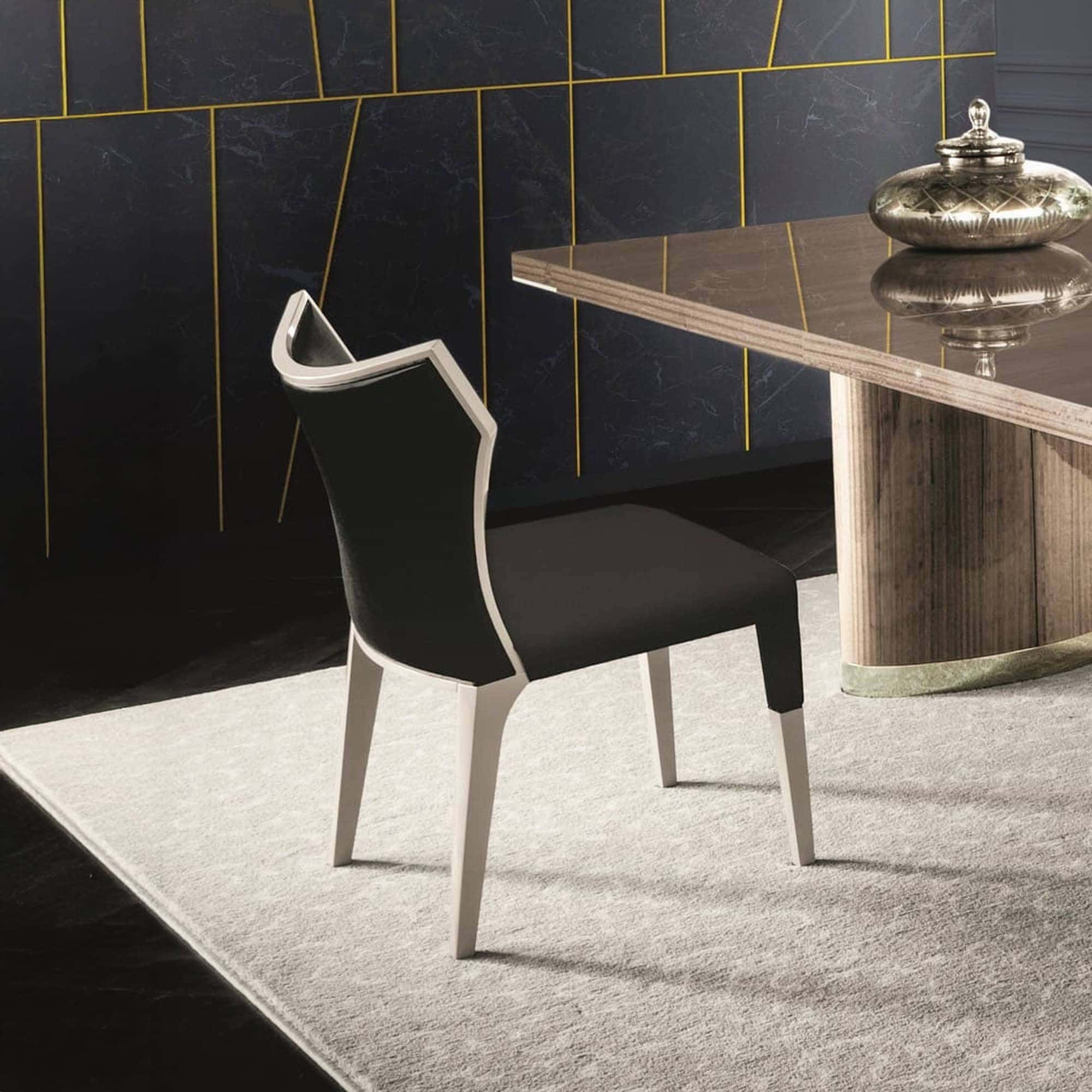 Modern black and white dining chair with sleek design.