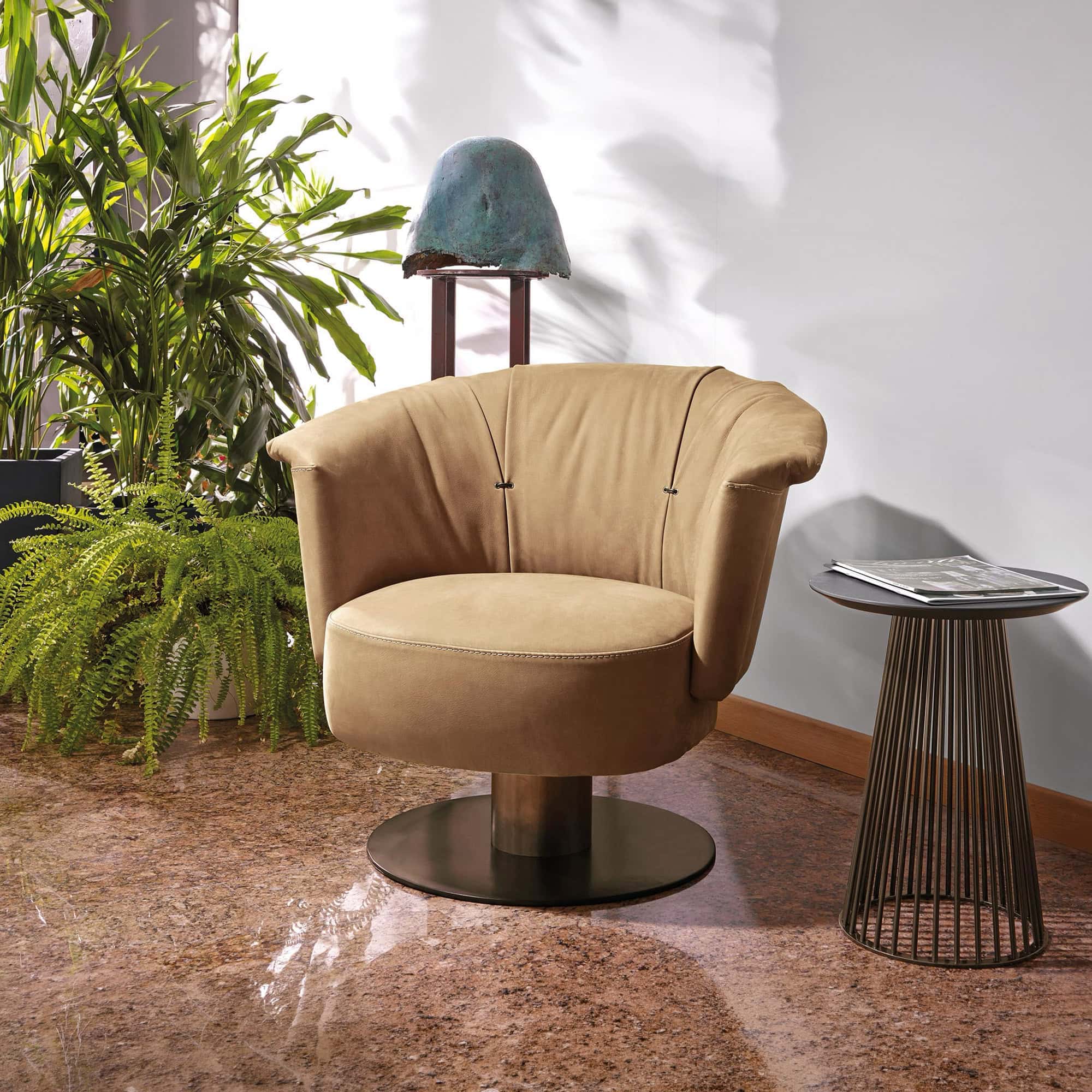 Modern Gamma lounge chair with beige upholstery and unique design.