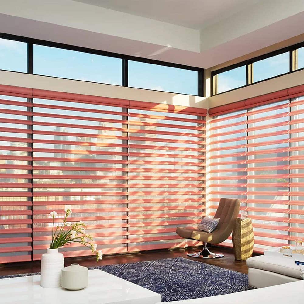 Elegant Hunter Douglas blinds in a bright, sunlit room with large windows.