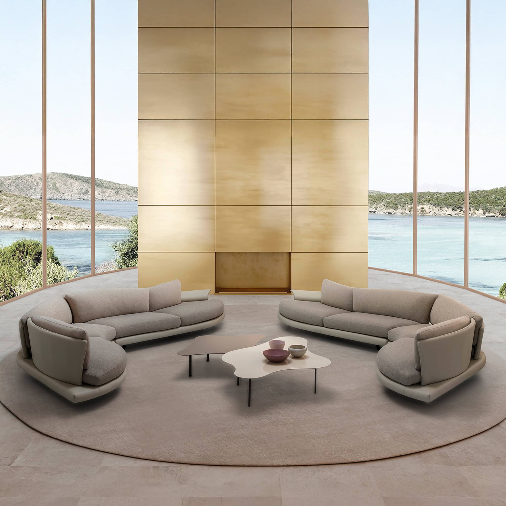 Luxurious interior with a taupe Super Roy sofa styled with a round golden coffee table and textured feature wall.
