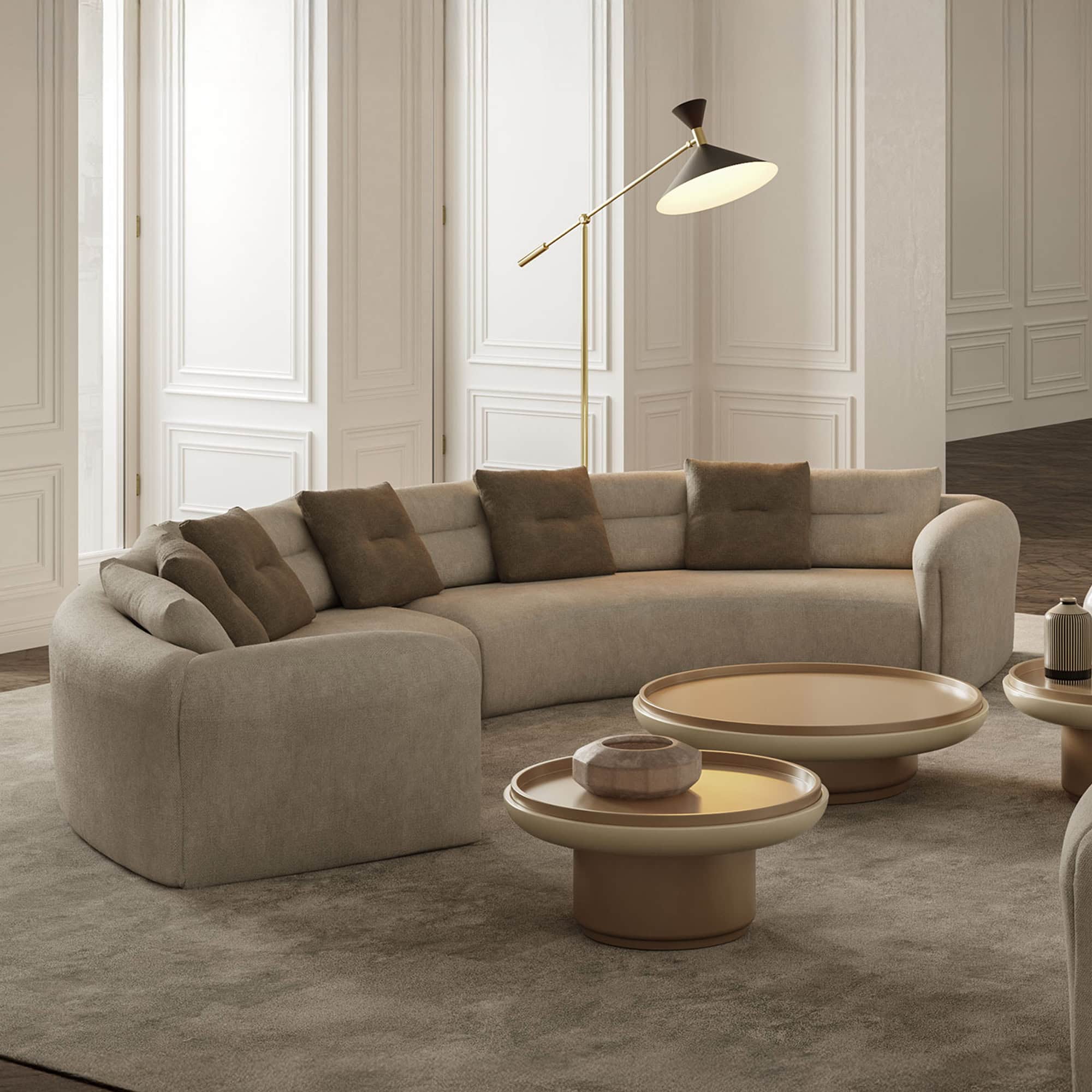 Quentin Amphitheatre Circular Modular Sofa in a bright living space with soft fabric and round table.