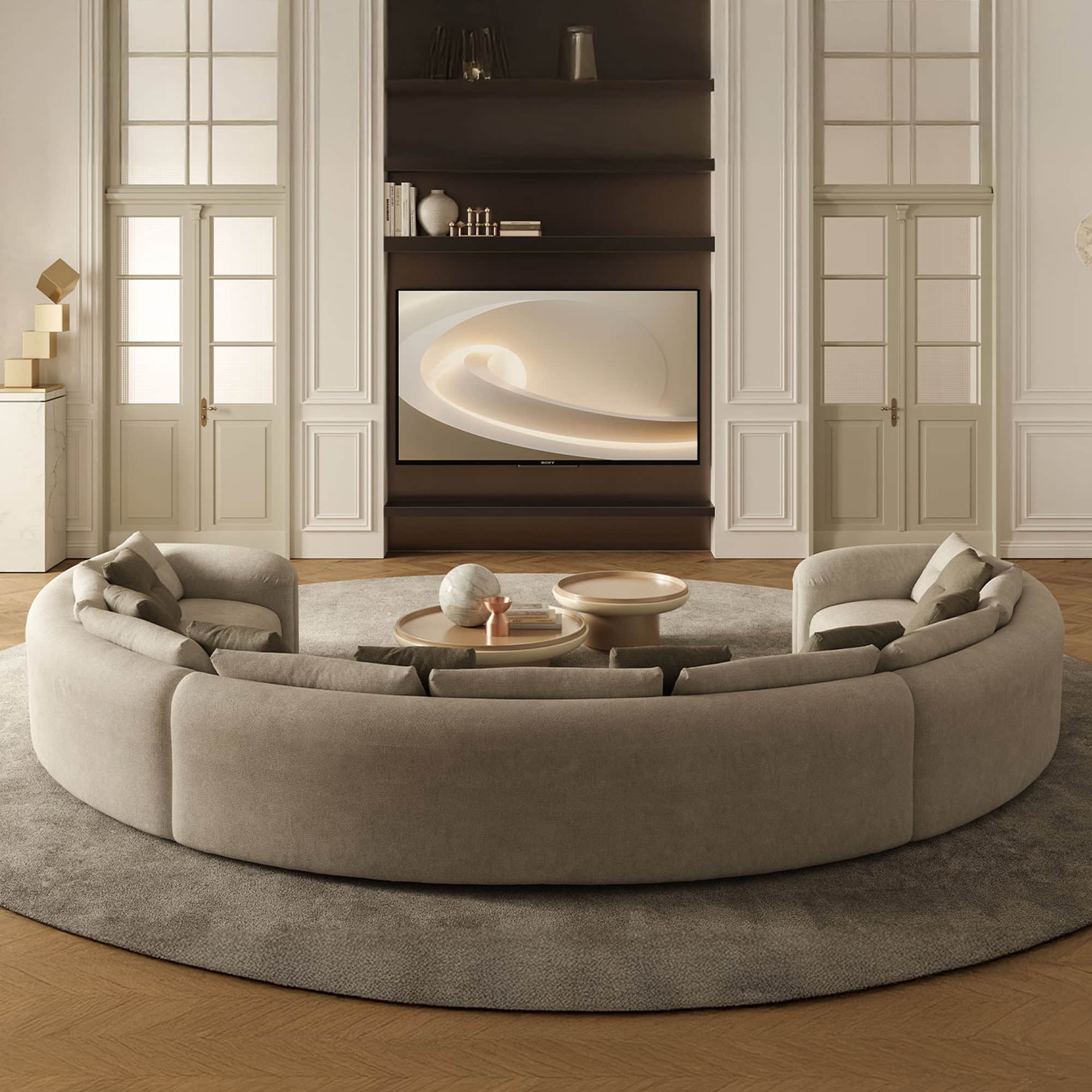 Quentin Amphitheatre Circular Modular Sofa styled with cushions in an elegant neutral interior.