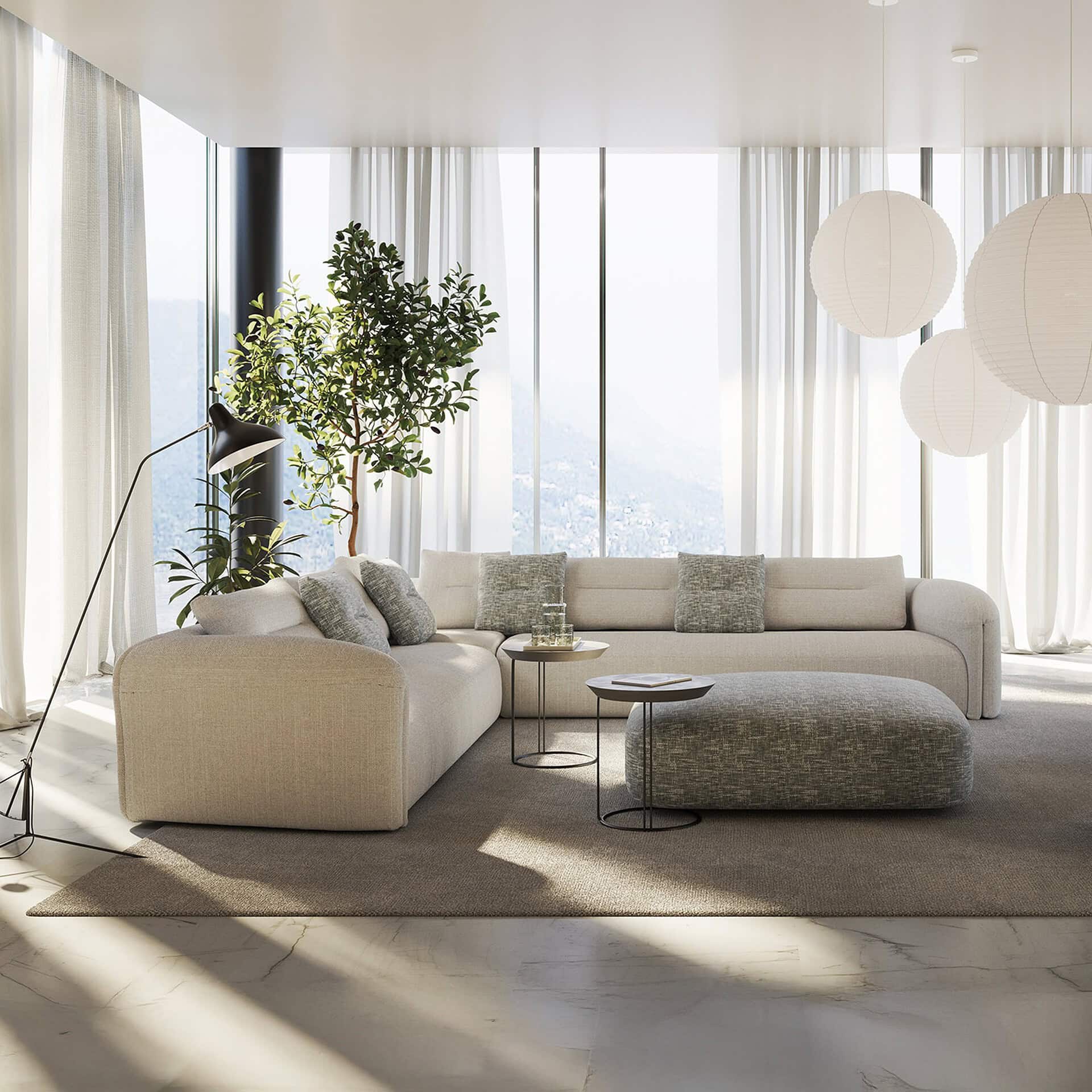 Quentin Angular Modular Sectional Sofa in a bright modern living room with white upholstery and natural light.