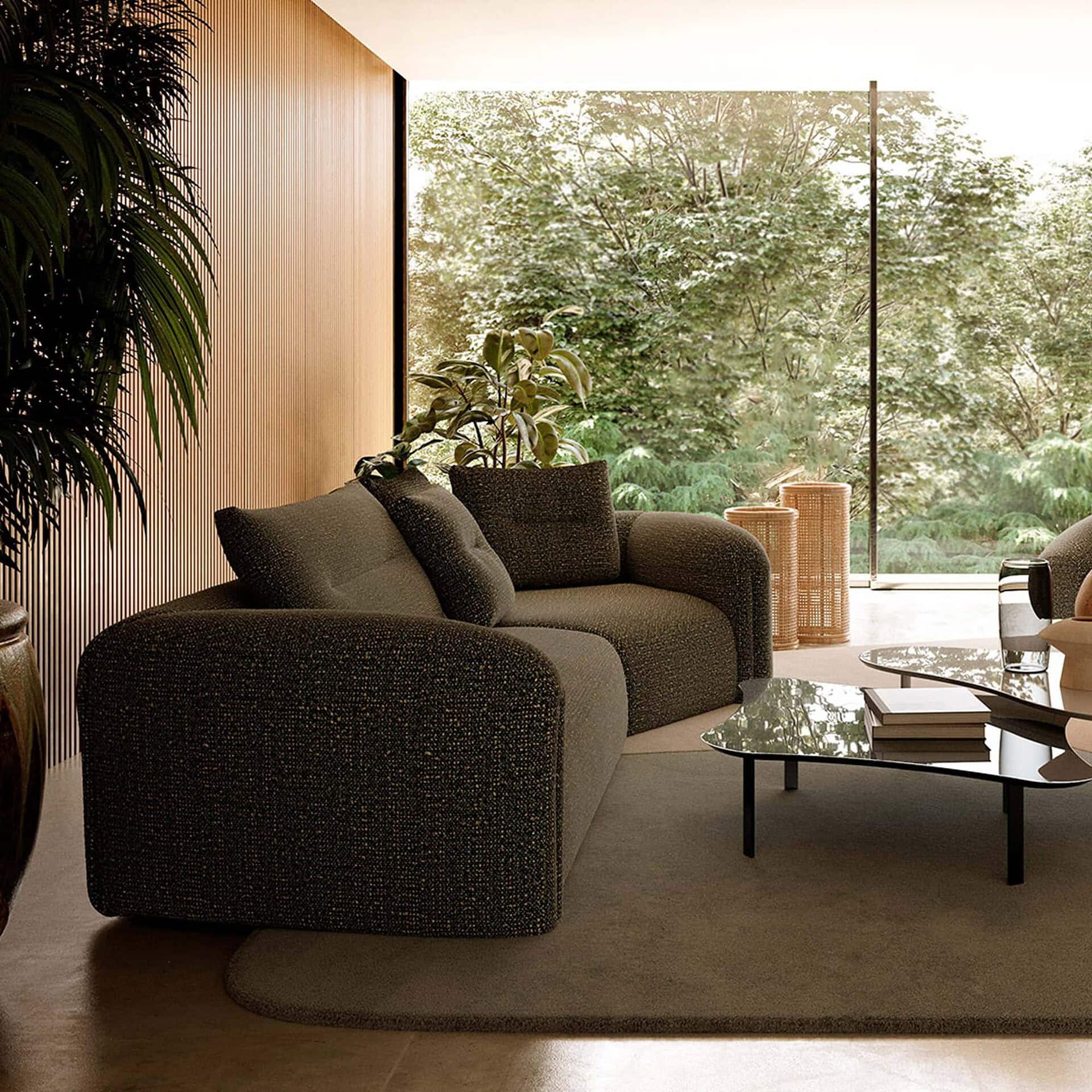 Quentin Angular Modular Sectional Sofa in olive green upholstery styled with a small modern side table.