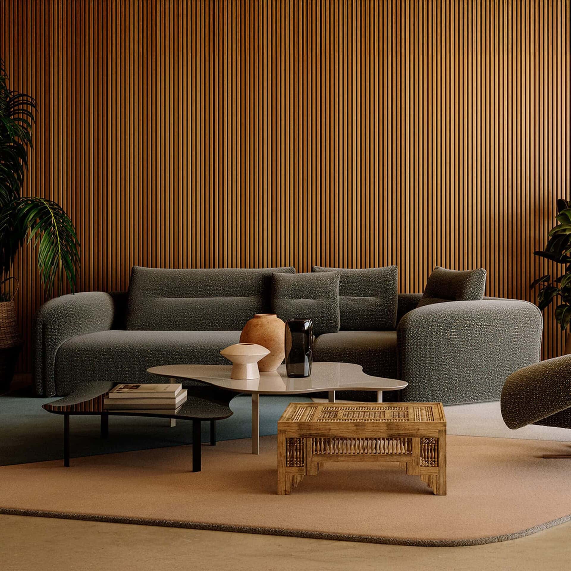 Quentin Angular Modular Sectional Sofa in dark upholstery set against a wood-paneled accent wall.