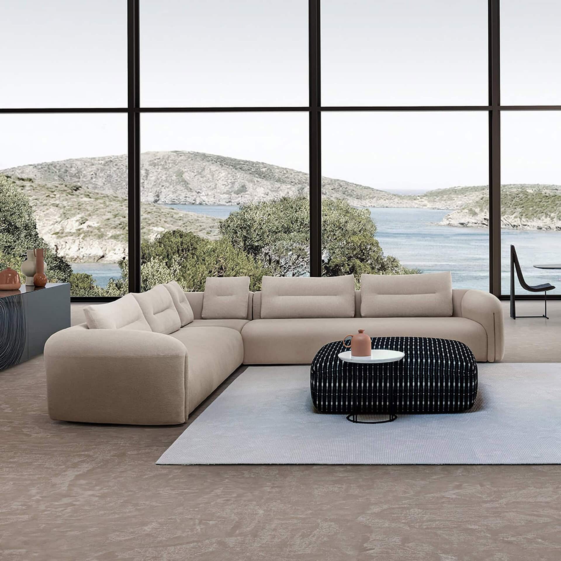 Quentin Angular Modular Sectional Sofa in off-white upholstery styled with a modern black coffee table.