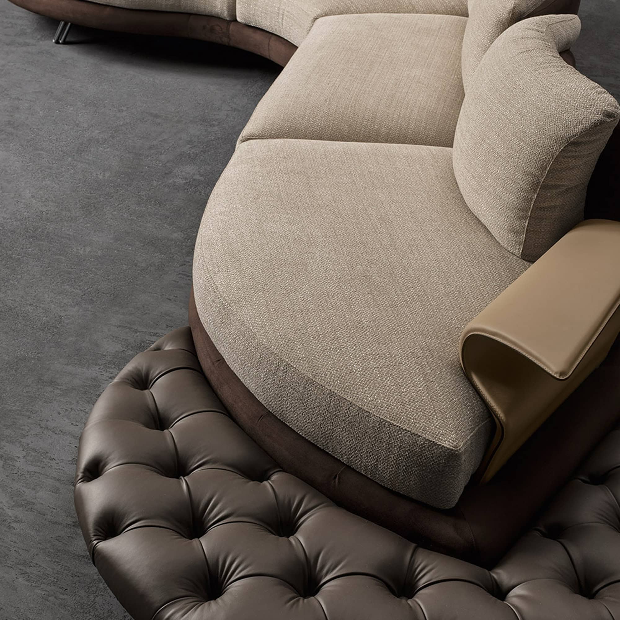 a couch with a round ottoman
