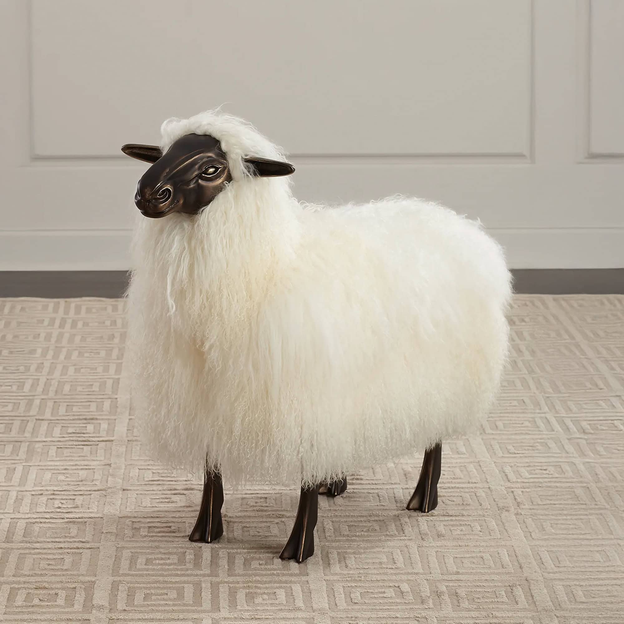 Leon Sheep Sculpture in black bronze with ivory sheepskin, styled in interior setting