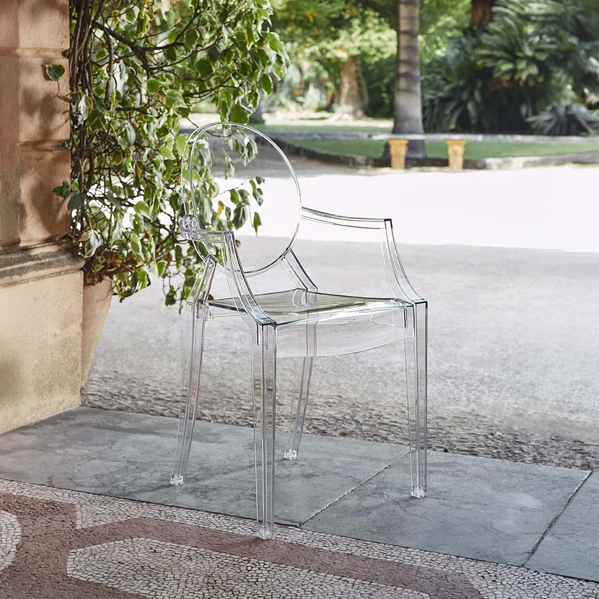 Louis Ghost Chair placed outdoors on a stone patio