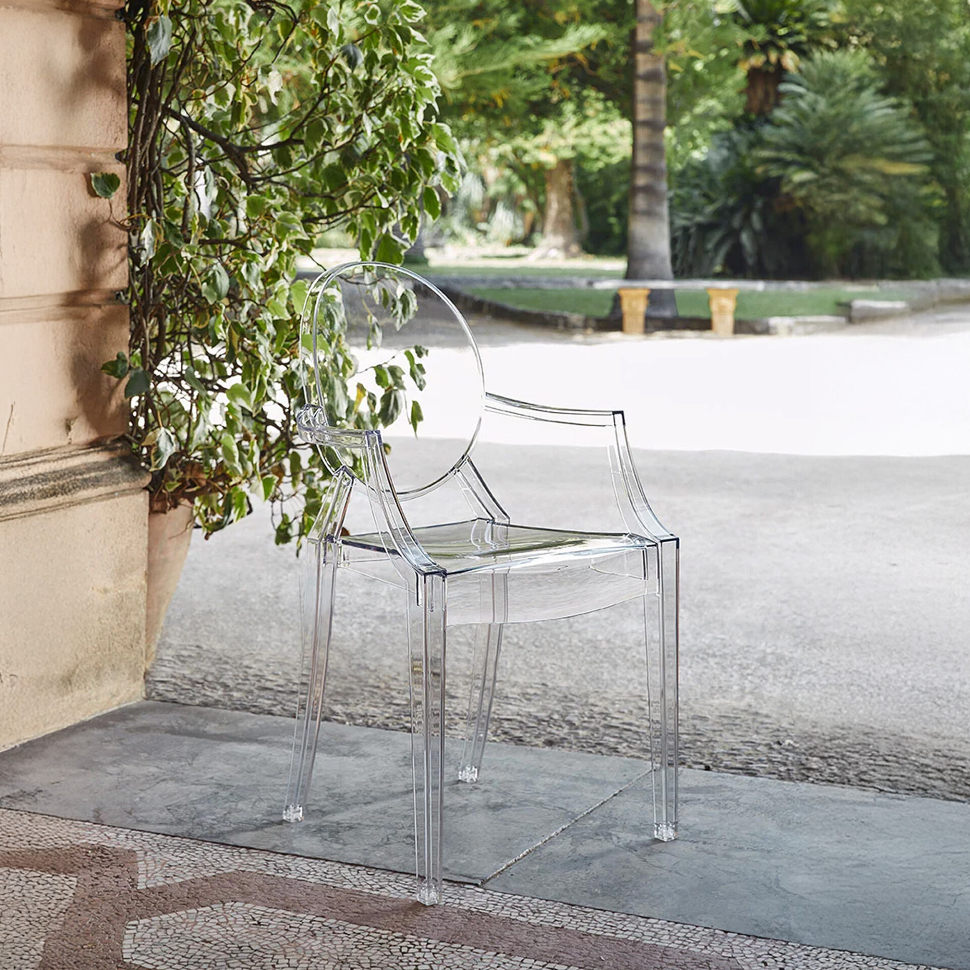 Louis Ghost Chair placed outdoors on a stone patio