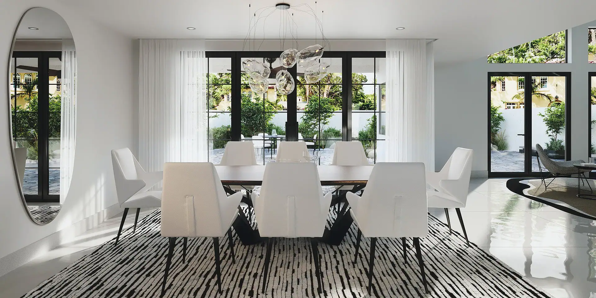 Bright dining room with white chairs and black window frames.