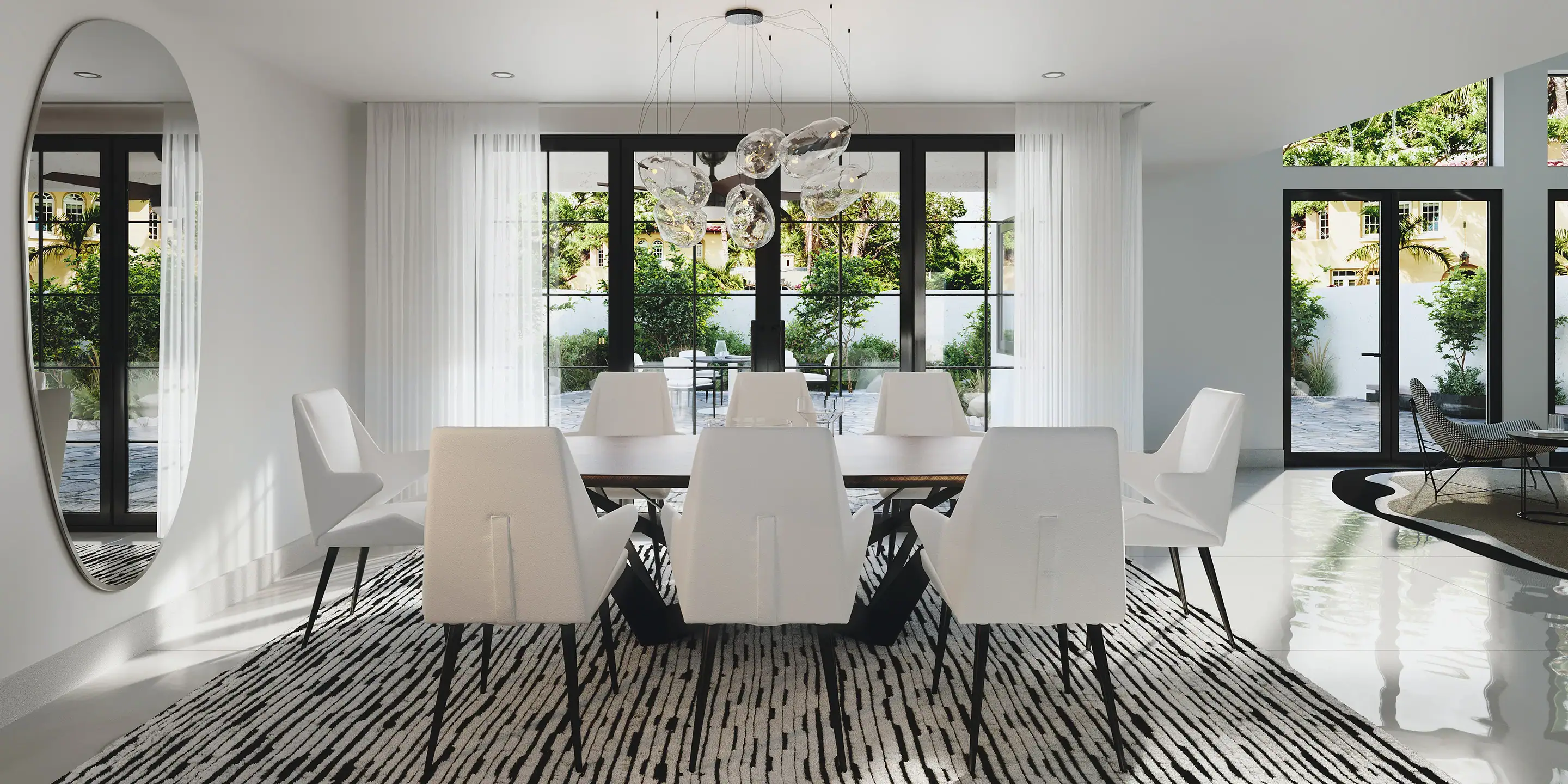 Bright dining room with white chairs and black window frames.