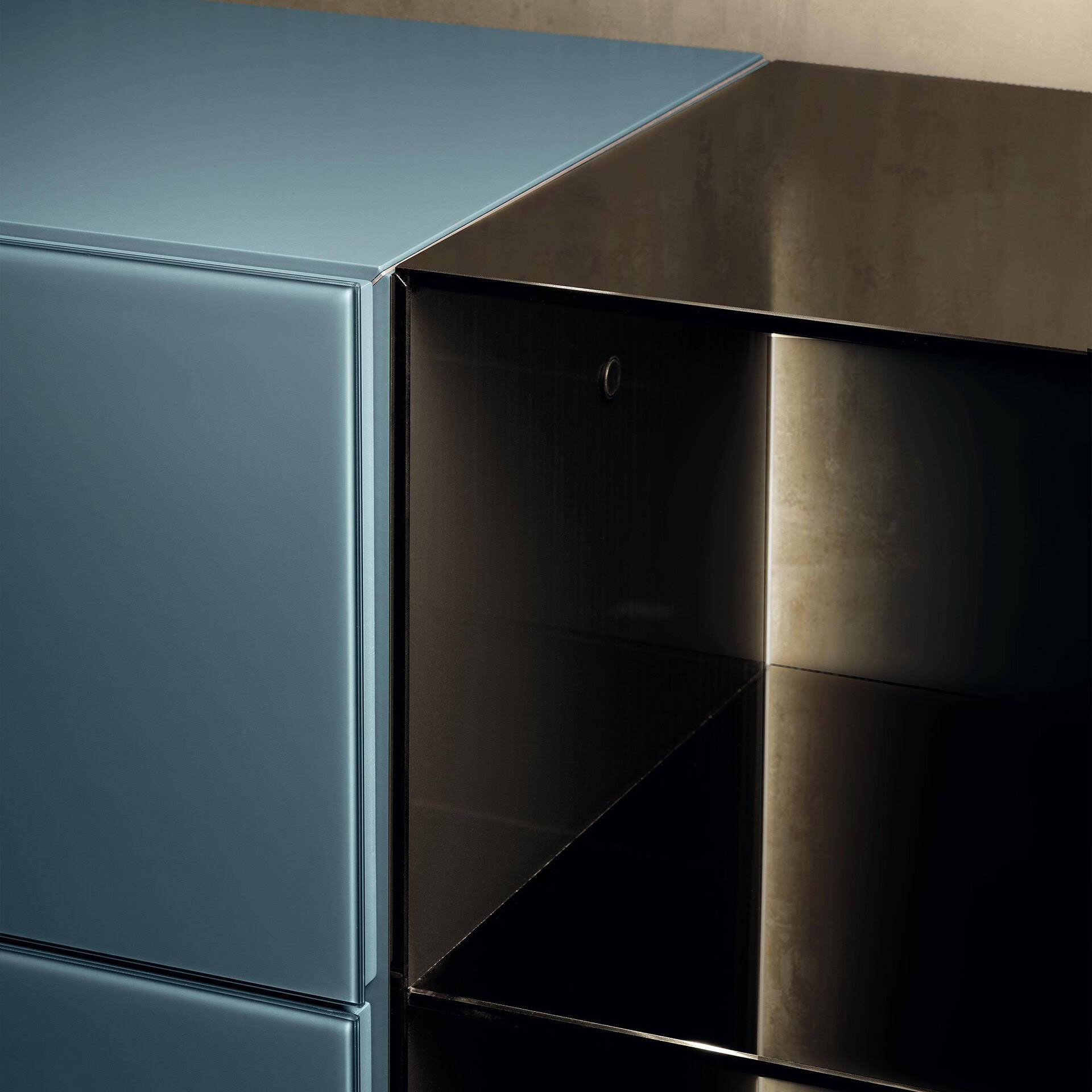 Modular glass dresser with sleek blue and black finishes, perfect for modern bedroom storage solutio.