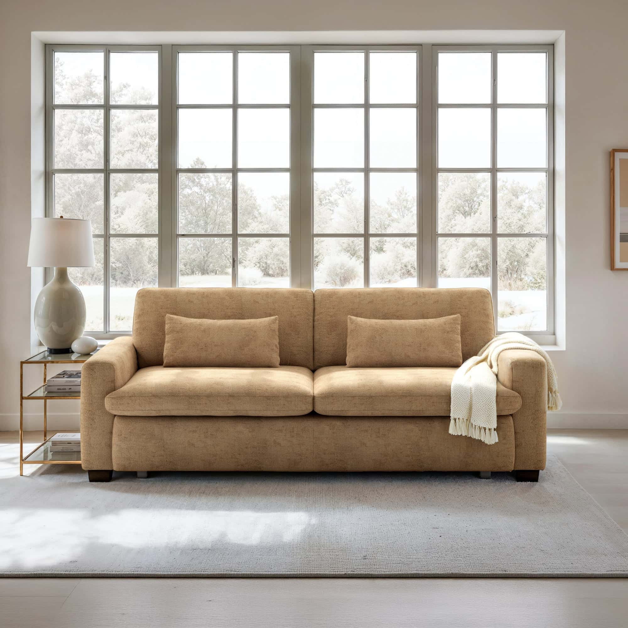 Kai Full-Size Sleeper Sofa in a modern living room with large windows and light wood floors.