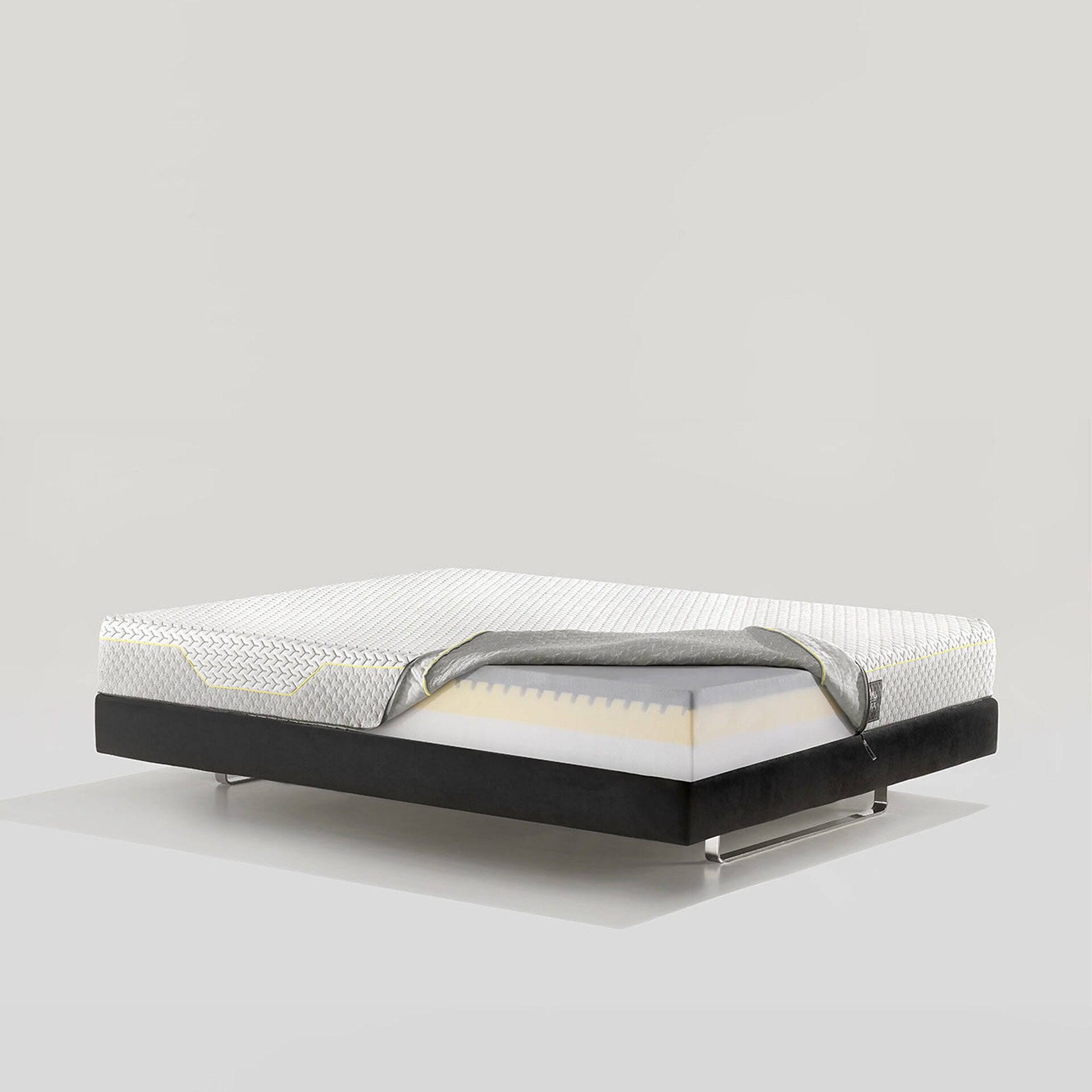 Memory foam mattress displayed on a sleek black bed frame for comfortable sleep.