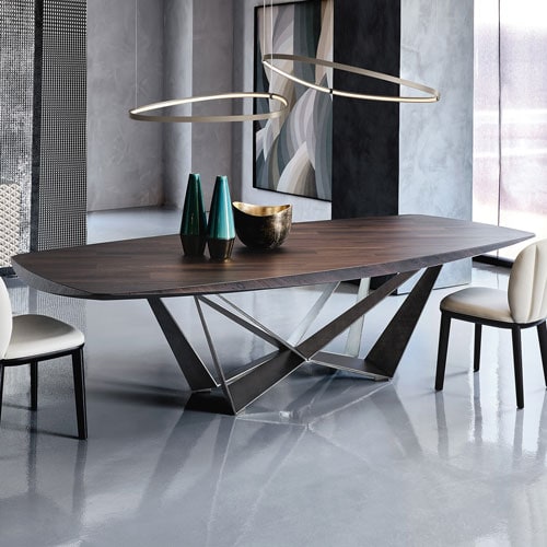 Contemporary wooden dining table with unique lighting fixture and stylish decor.