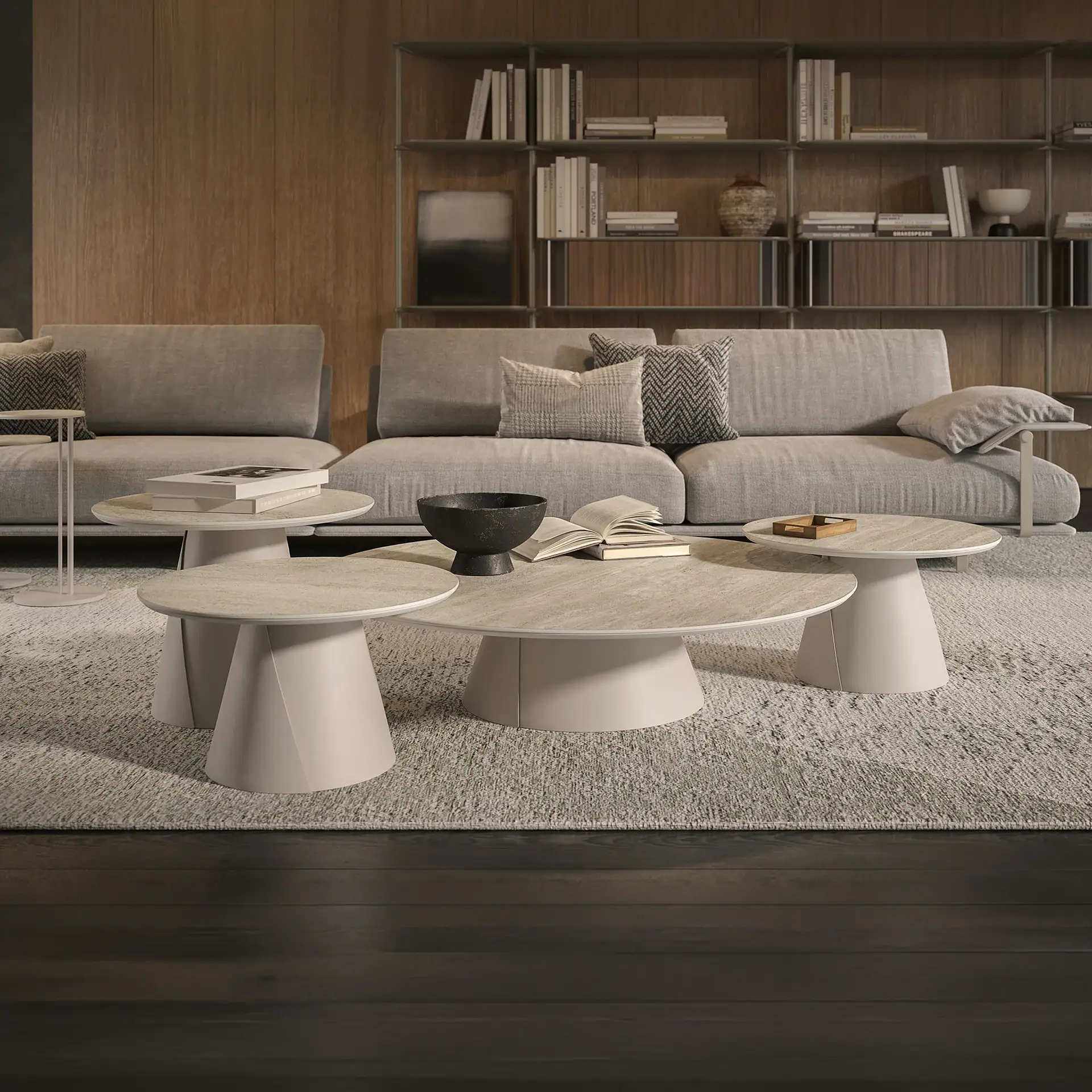 Contemporary white coffee tables with unique pedestal bases in a stylish living room setting.