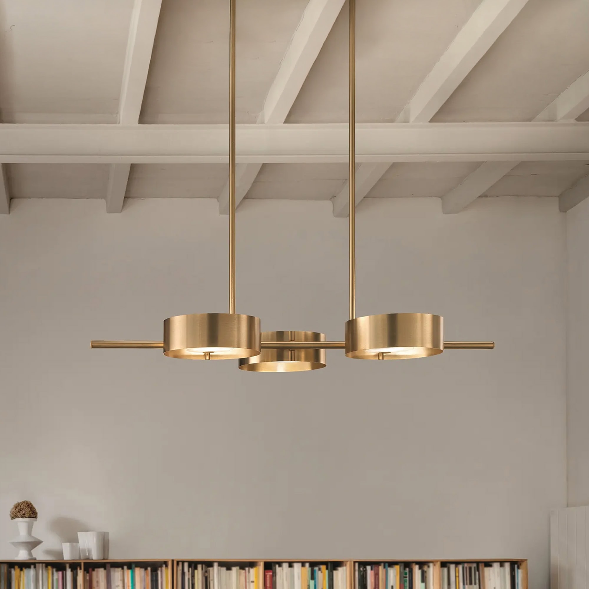 Gold pendant light fixture for contemporary interiors.