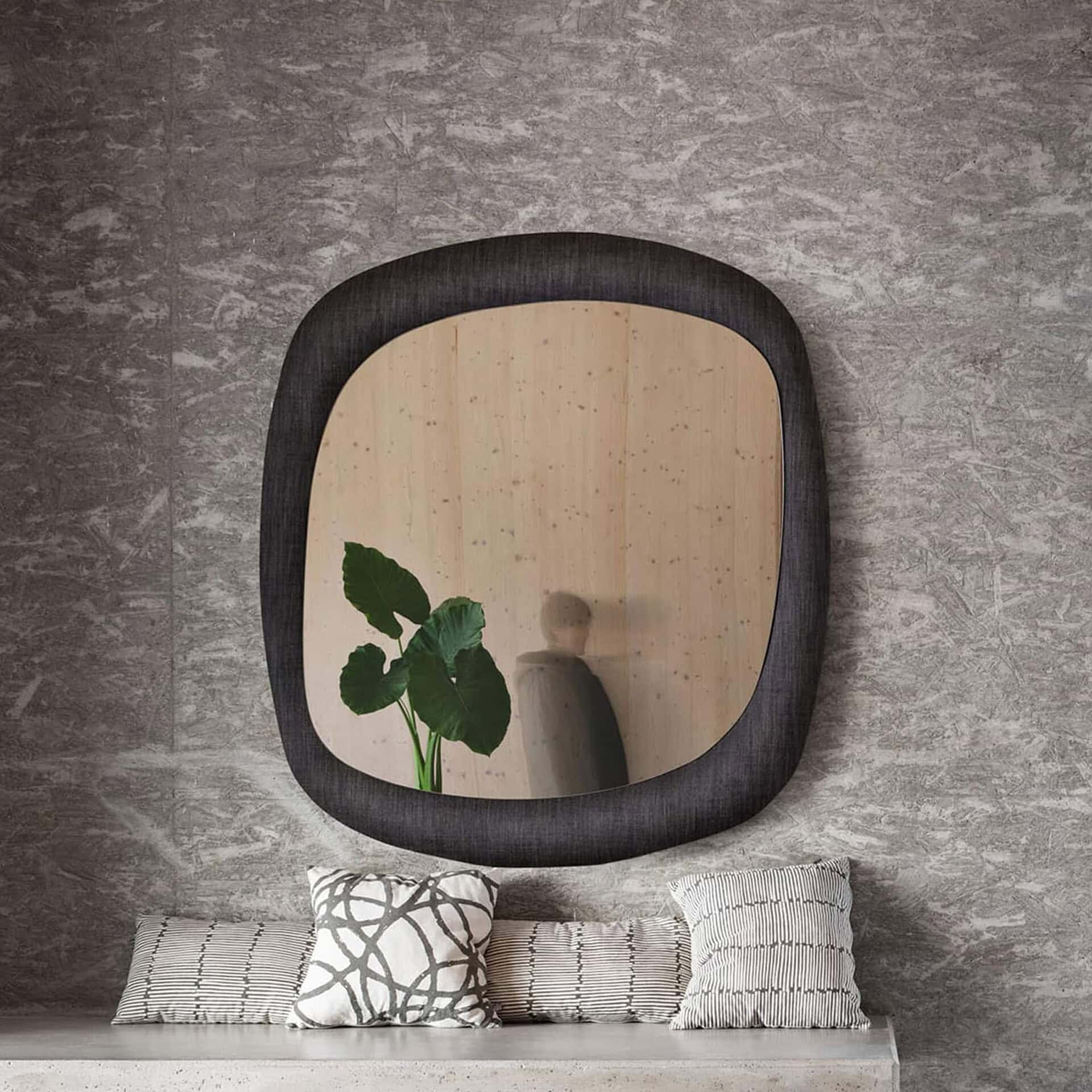 Bold Curved Wall Mirror in a modern bathroom setting with rounded square shape and reflective glass.