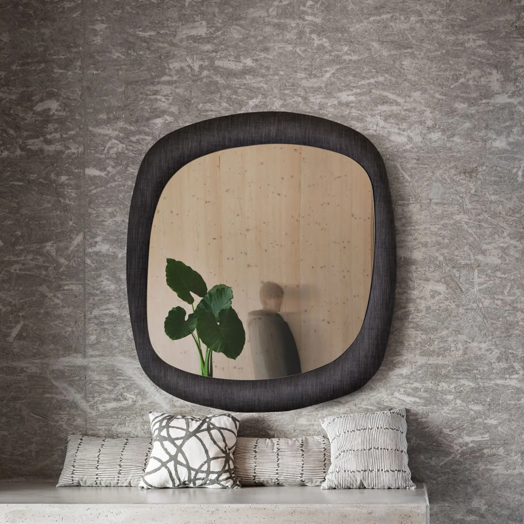 Bold Curved Wall Mirror in a modern bathroom setting with rounded square shape and reflective glass.