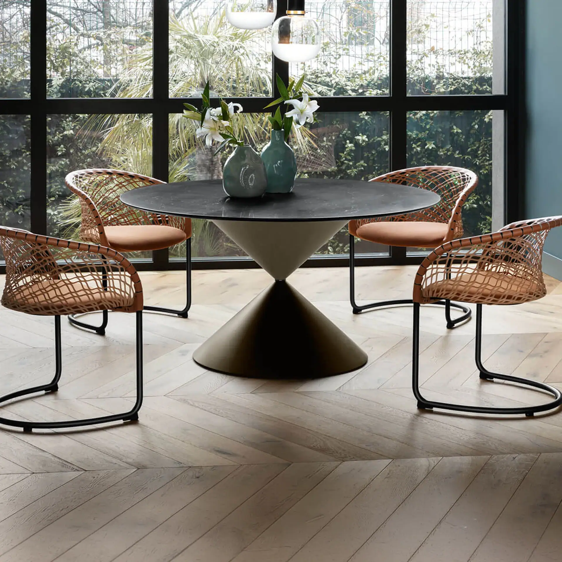 Stylish wooden dining table with contemporary black pendant light and minimalist shelving for modern.