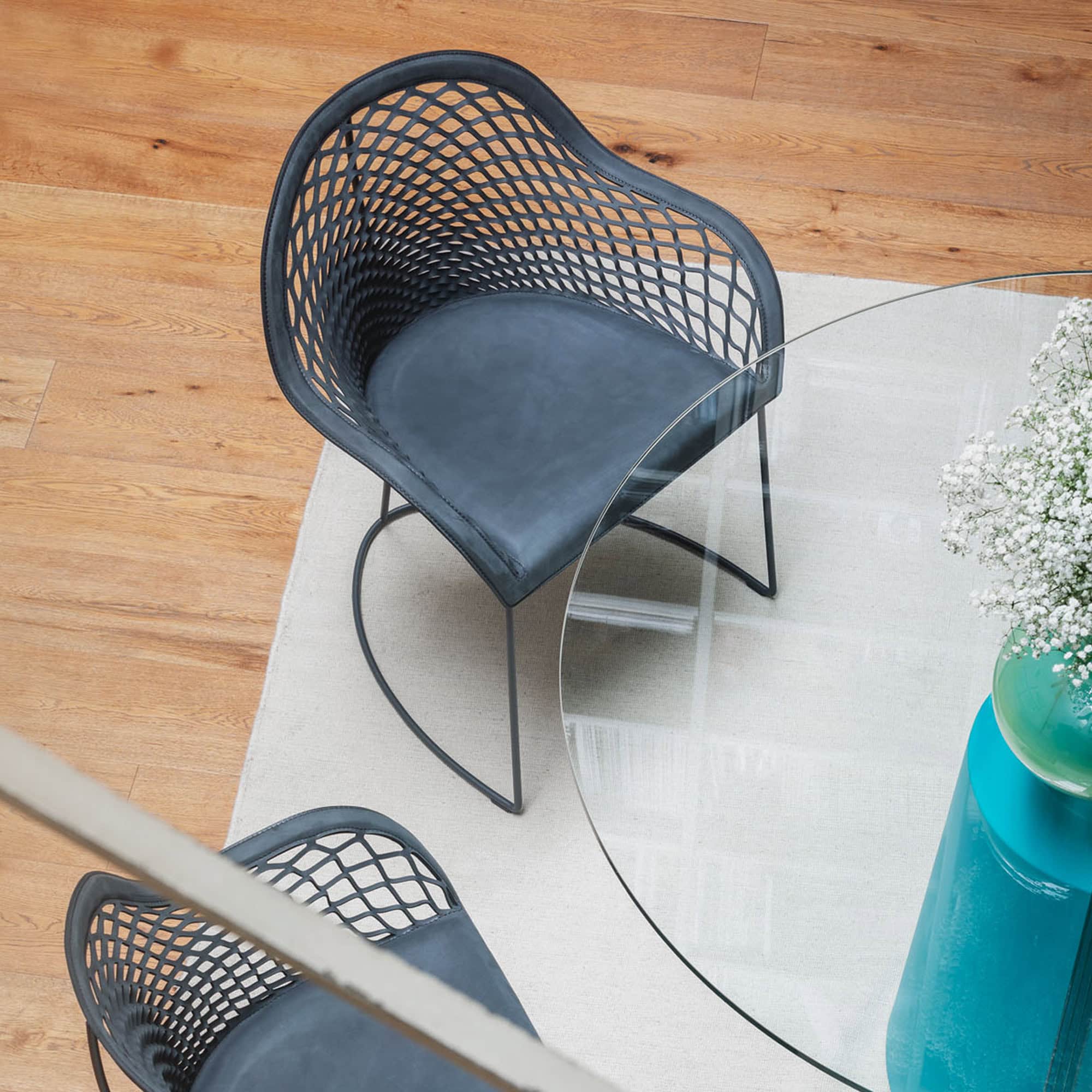 Guapa Armchair and a glass table