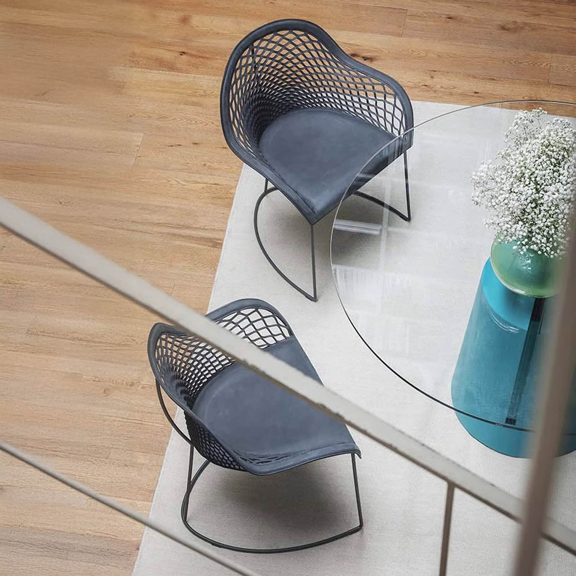 Top view of Guapa Leather Armchairs with woven leather seats in a lounge setting.