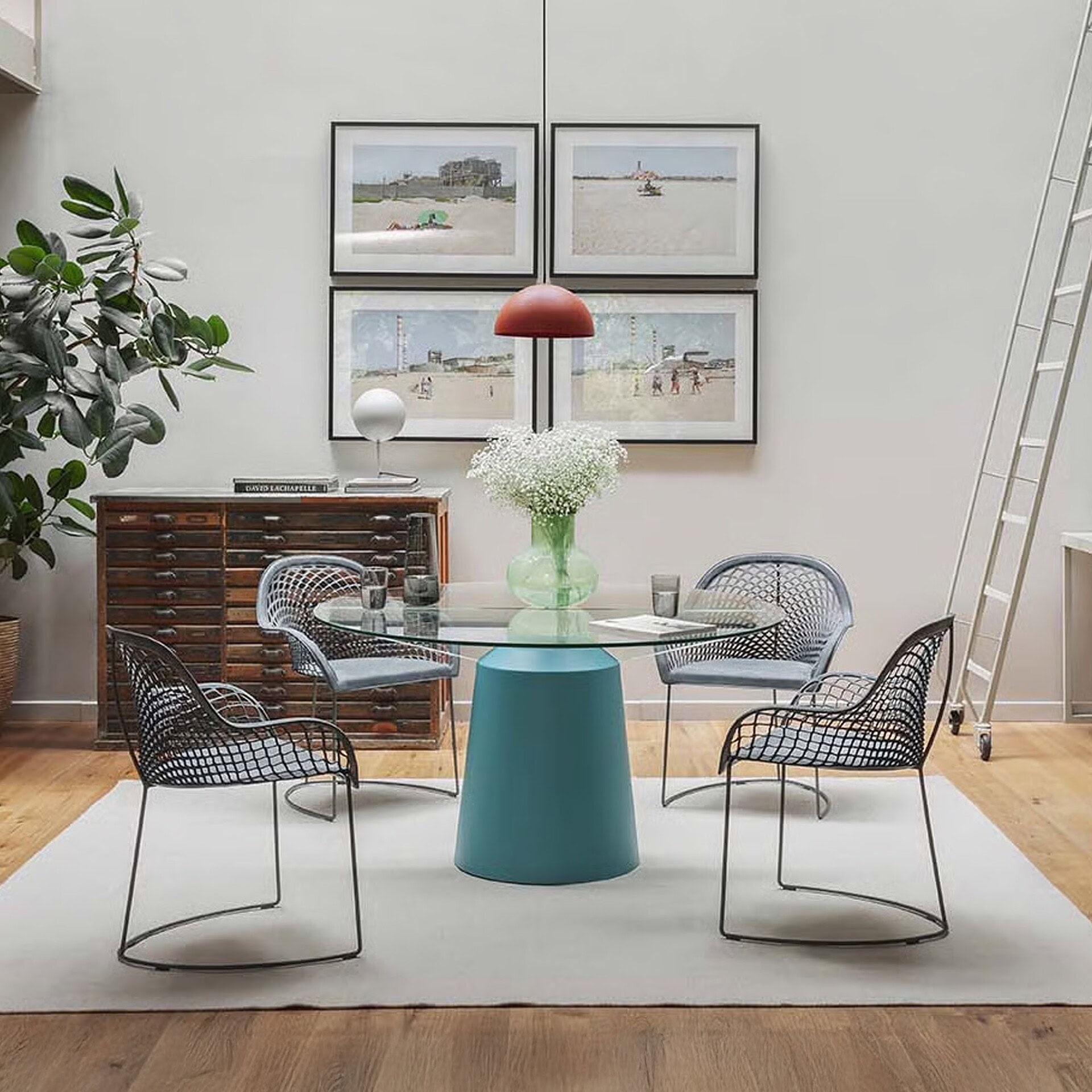 Pair of Guapa Leather Armchairs with round table in a contemporary living space.