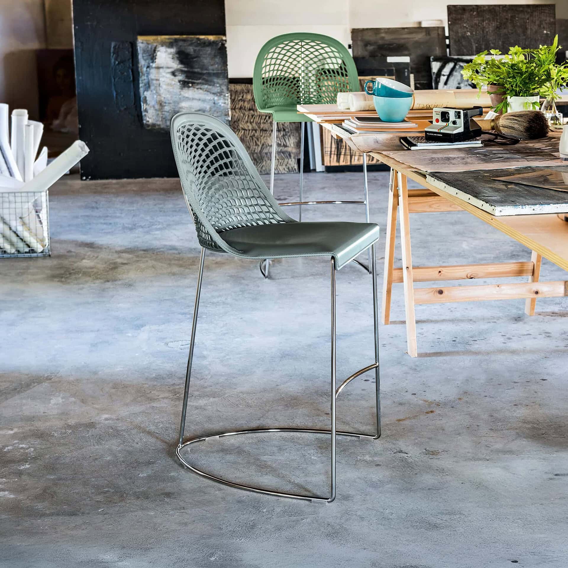 Elegant Guapa leather bar stool with a modern design and metal frame. Perfect for contemporary kitch.
