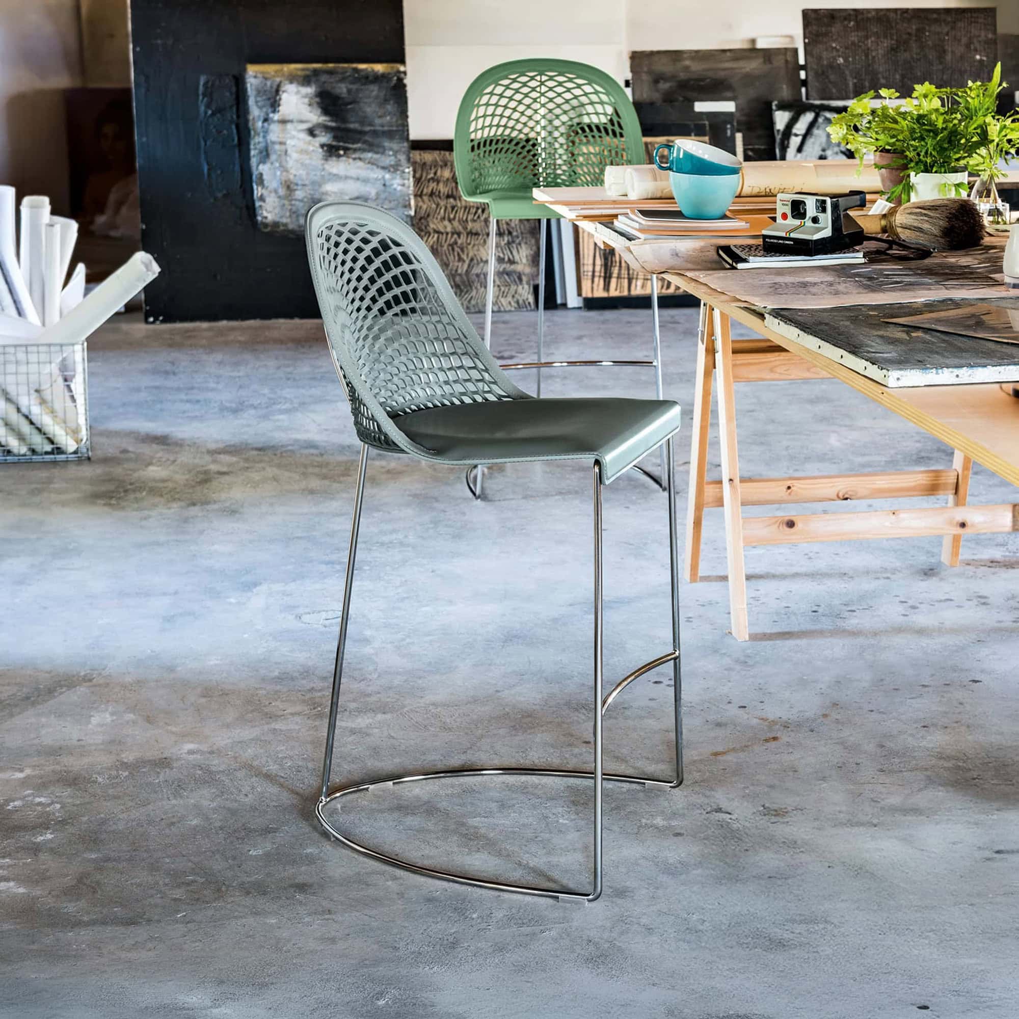 Elegant Guapa leather bar stool with a modern design and metal frame. Perfect for contemporary kitch.
