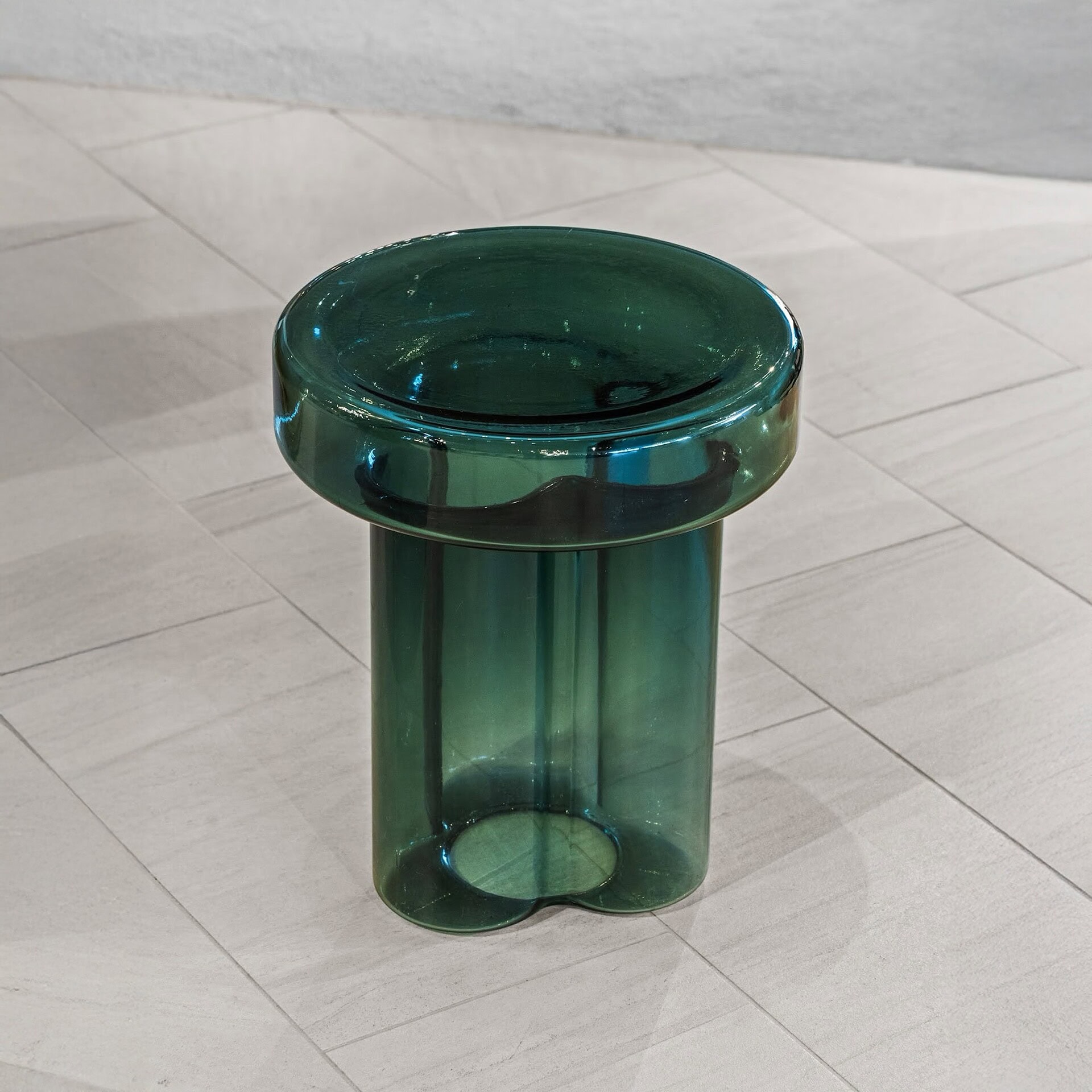 Elegant green glass side table showcasing modern design and craftsmanship from Sklar Furnishings.