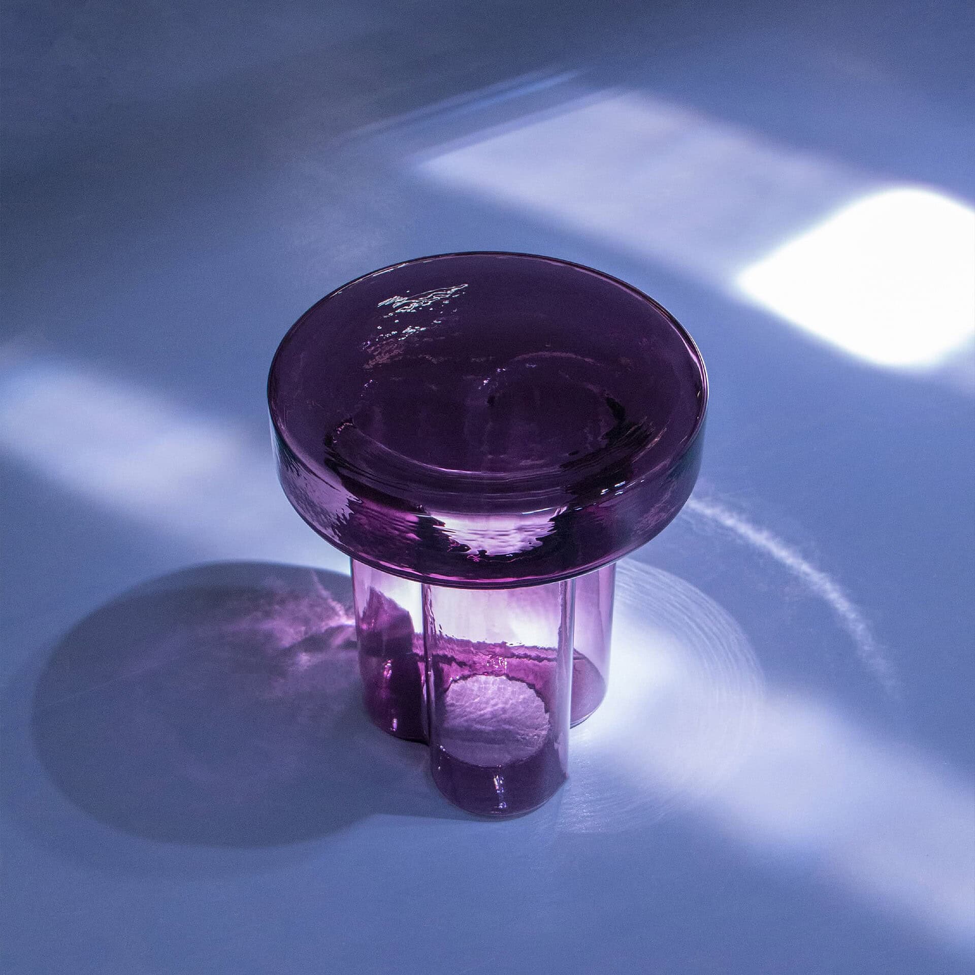Soda Hand-Blown Glass Coffee Table in Amethyst glass highlighted under soft natural light
