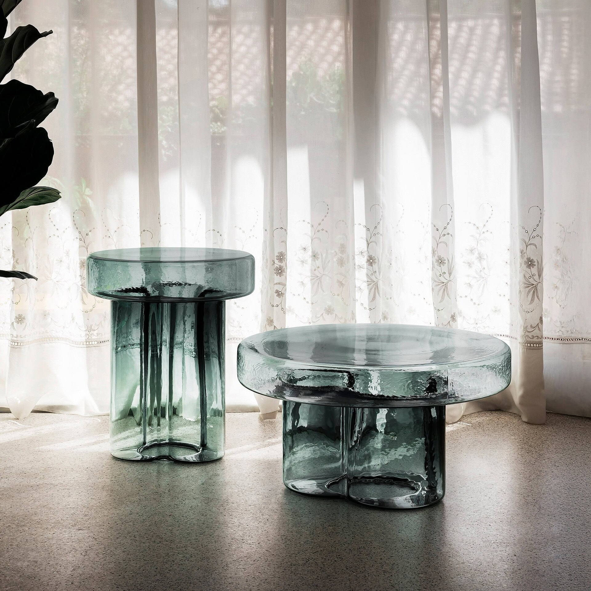 Set of Soda Hand-Blown Glass Coffee Tables in Petrol Green glass in a minimalist interior