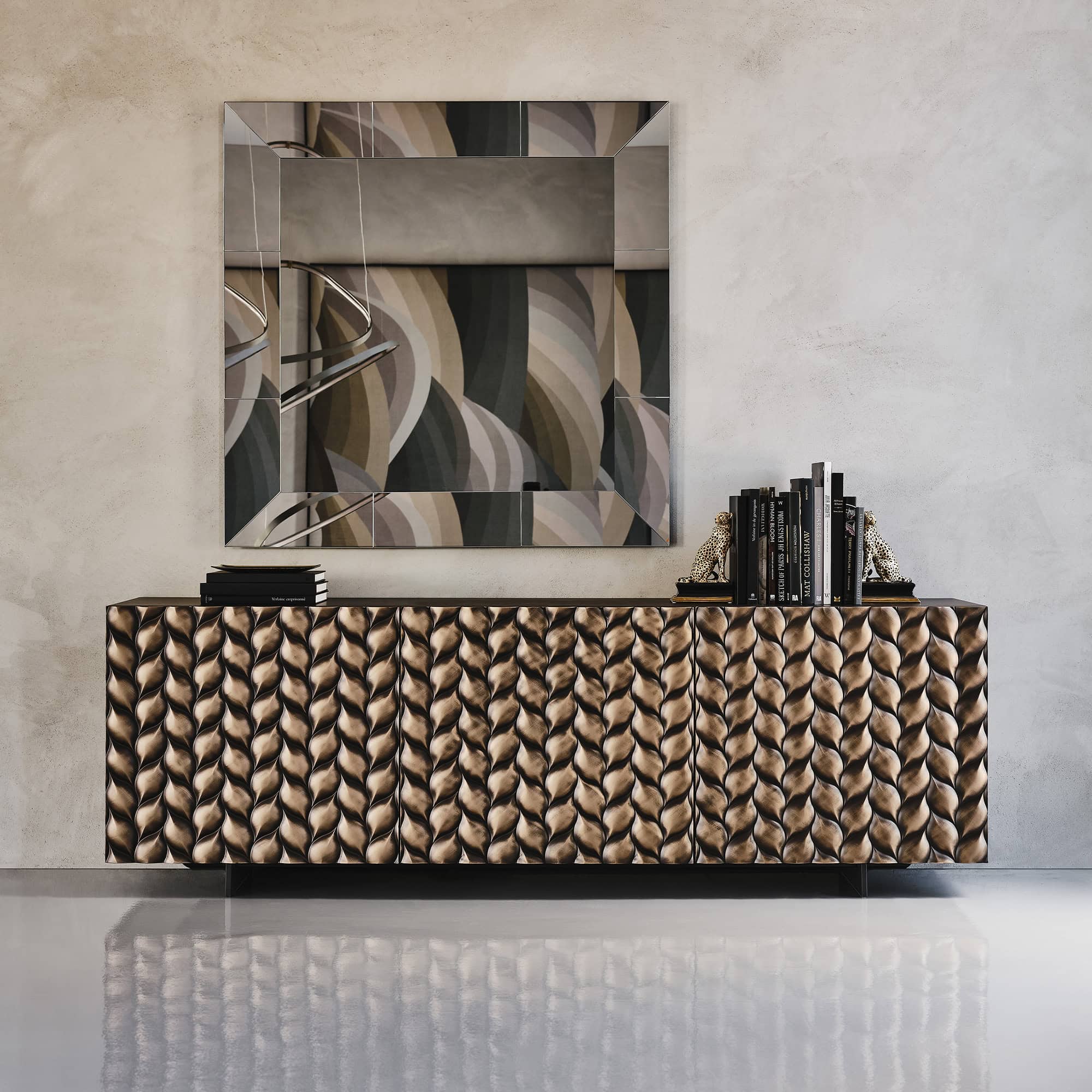 Contemporary sideboard with a textured, metallic finish and decorative accents in a modern interior.