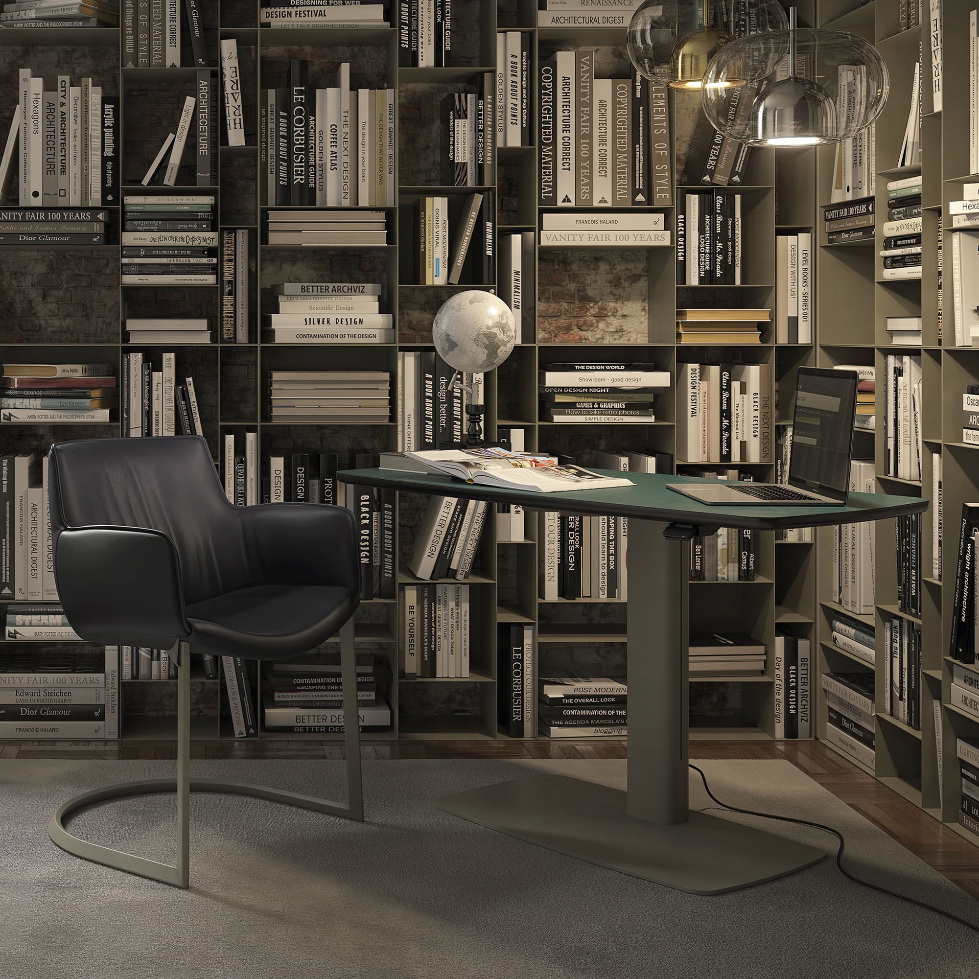 Modern office workspace with a black leather chair, glass desk, and extensive bookshelf filled with design books.