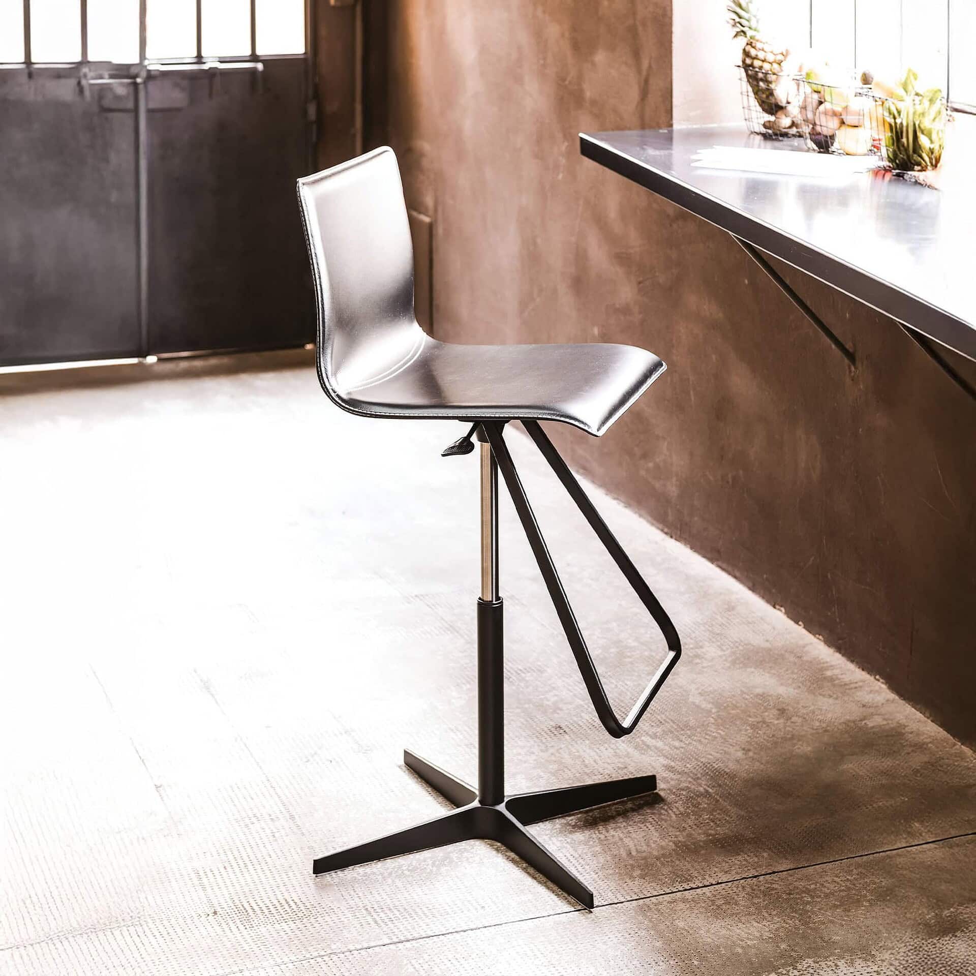 Silver modern contact chair by Sklar Furnishings for contemporary dining and cafe spaces.