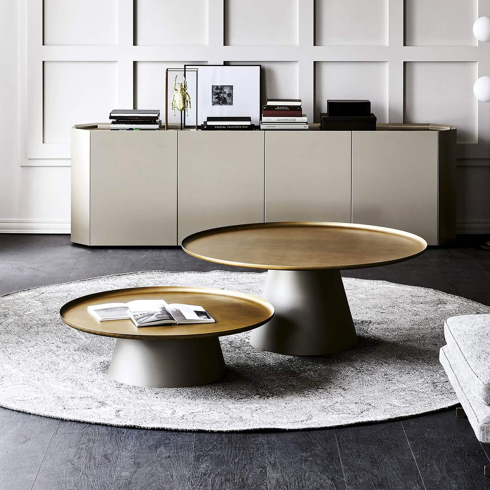 Cattelan Italia Amerigo Round Coffee Table in brushed bronze finish with mirrored top, styled in a modern living room.