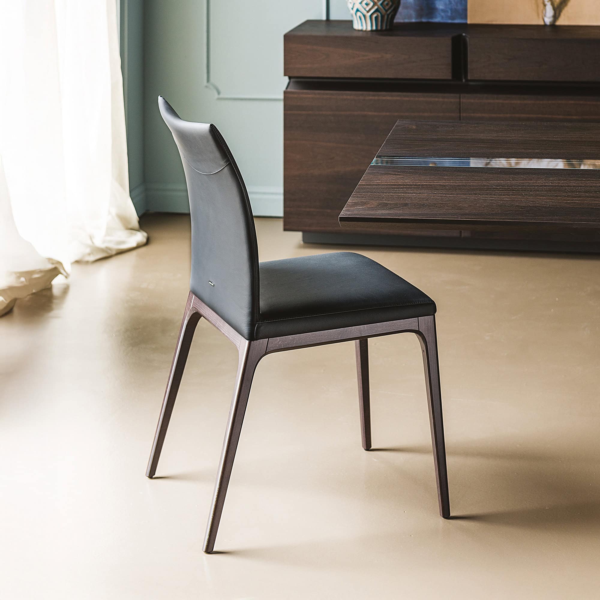 Arcadia Low Back Dining Chair, rear angled view highlighting sleek upholstered back and wooden legs