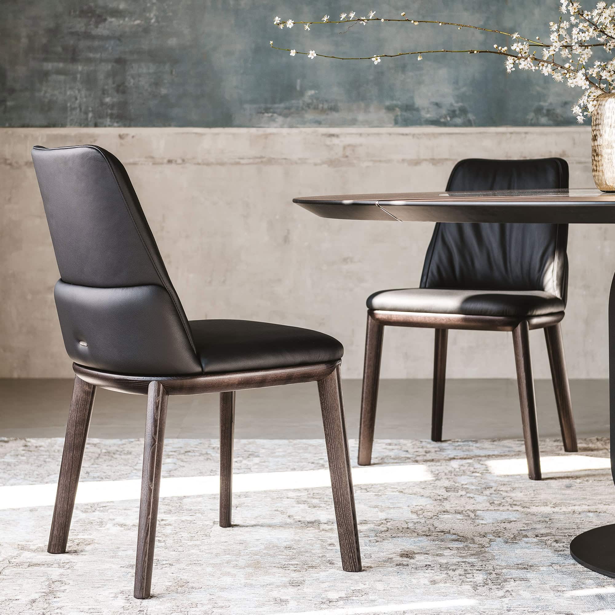 Pair of Belinda Dining Chairs in a contemporary dining room setting.