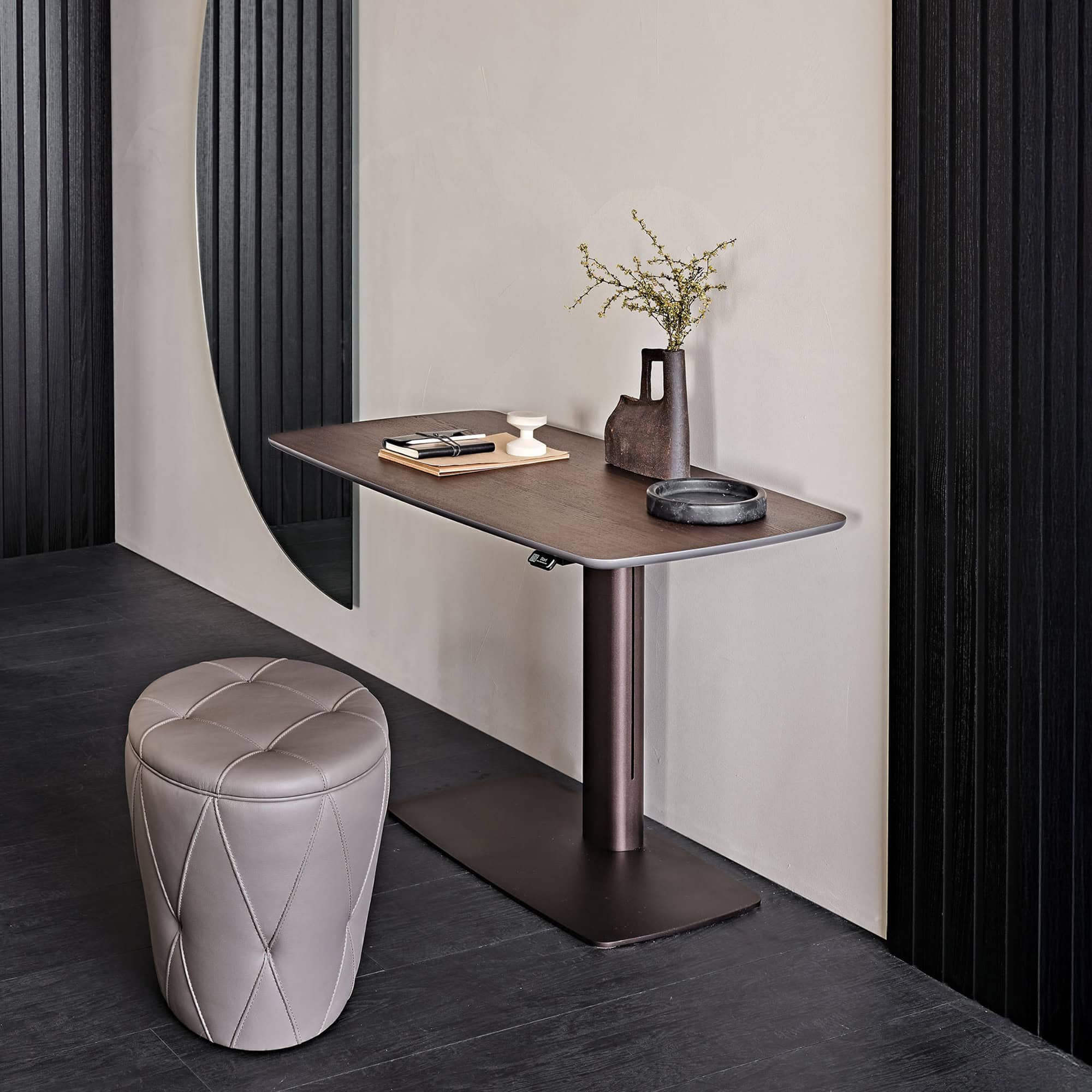 Runner Wood Adjustable Desk, slim profile with burned oak top and bronze embossed base, shown in modern interior