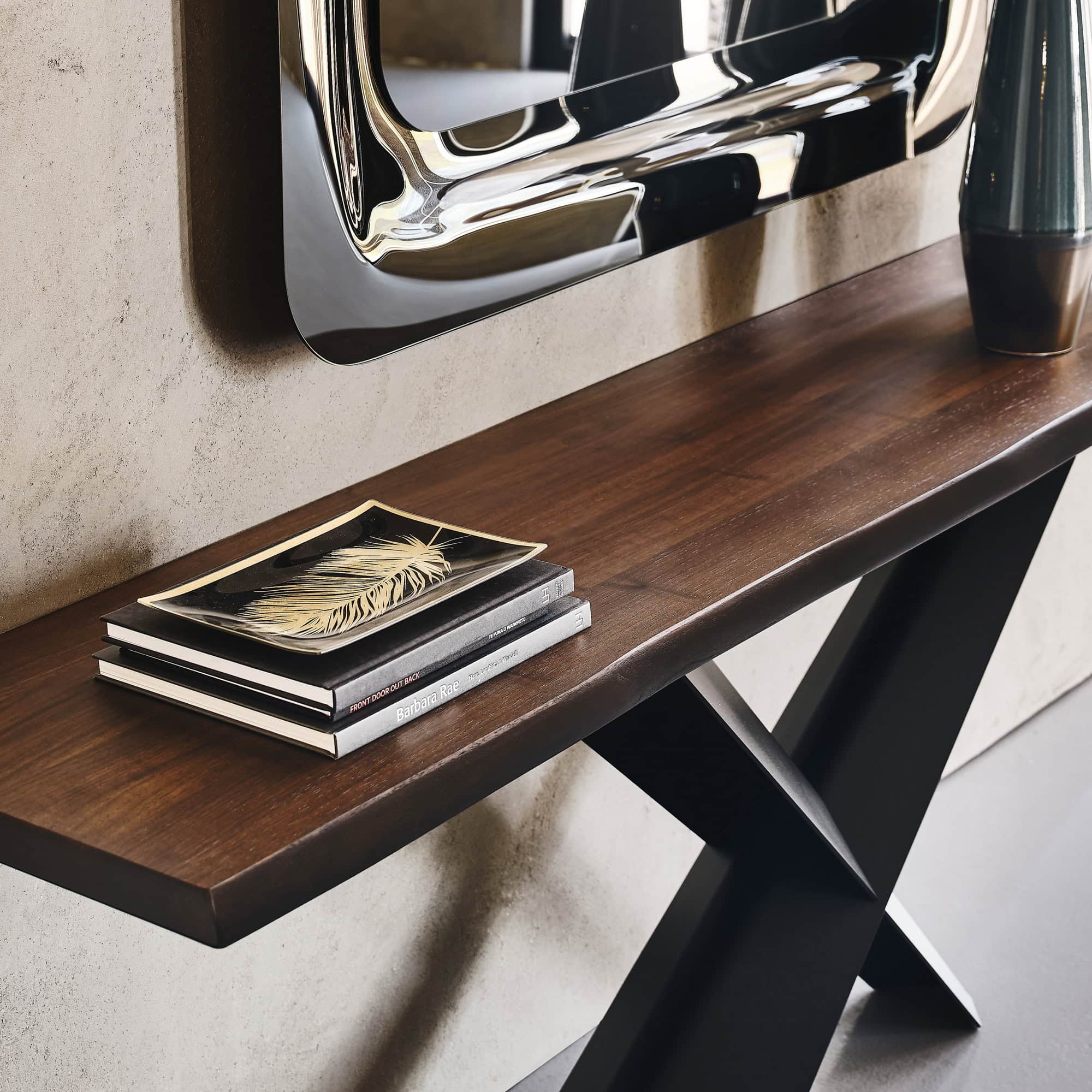 Close-up detail of the Terminal Console Table’s irregular wood edge and lacquered steel base.