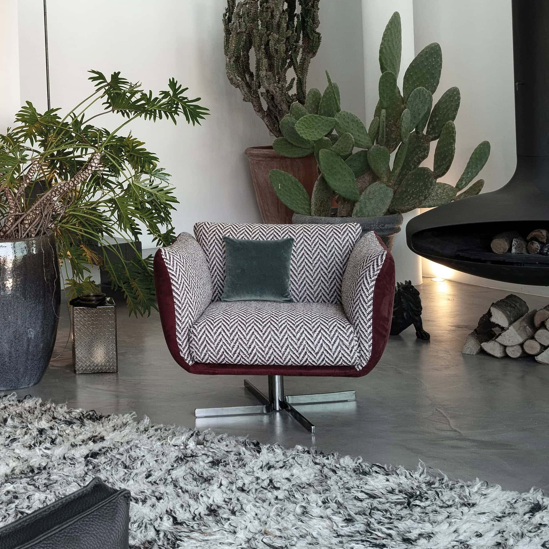 Elegant modern chair with bold fabric design in a stylish interior.