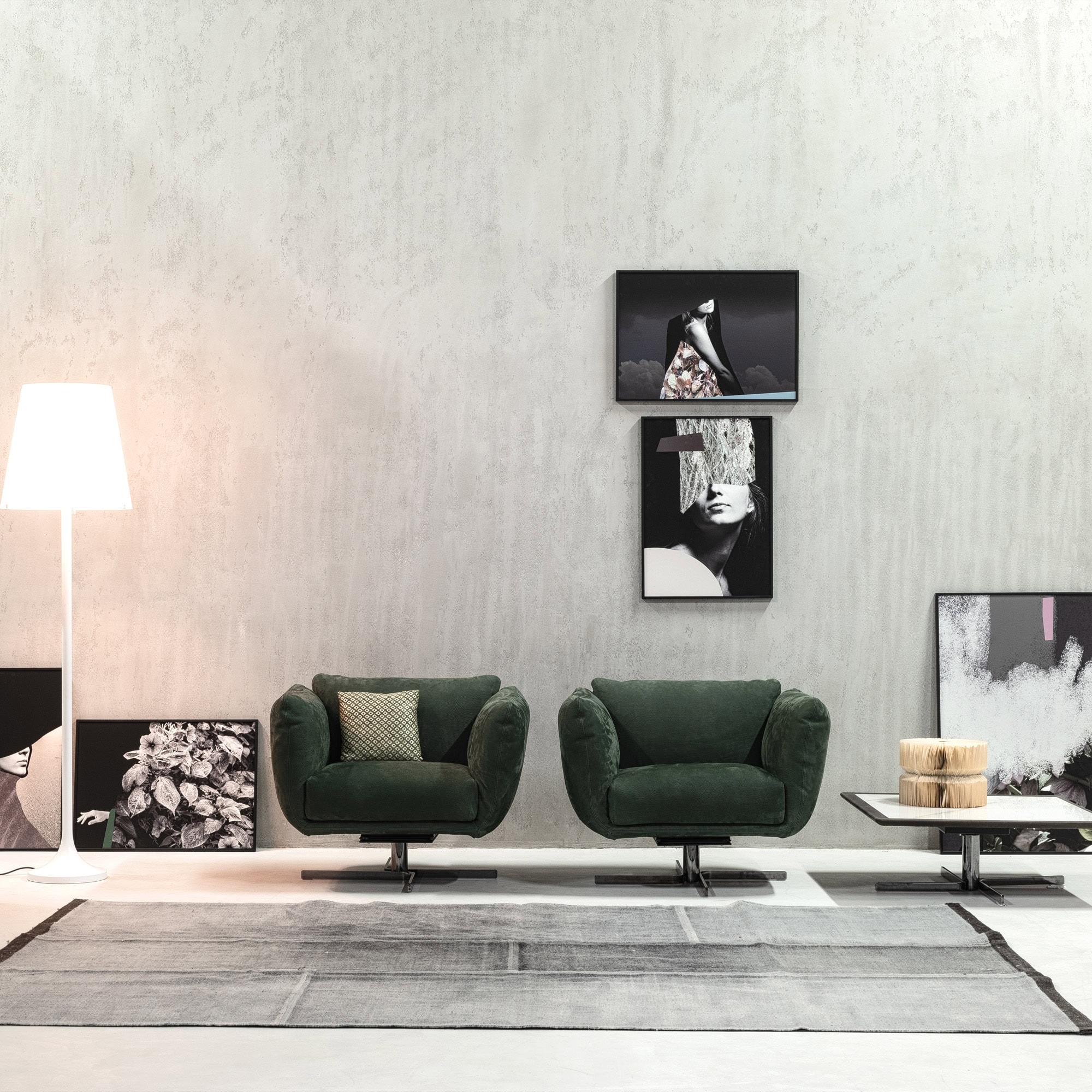 Amélie Swivel Armchairs in green leather displayed in a modern living room setting with clean lines and minimal décor.
