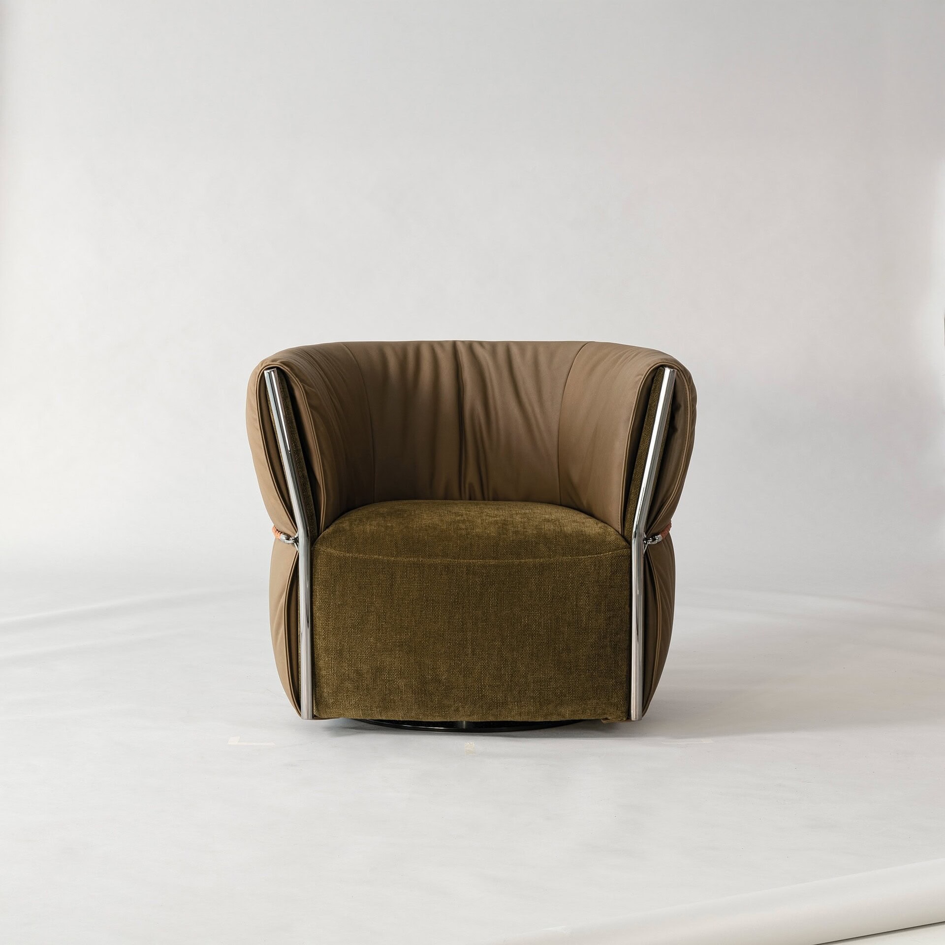 Belt Swivel Armchair front view showcasing soft leather upholstery and elegant rounded design.