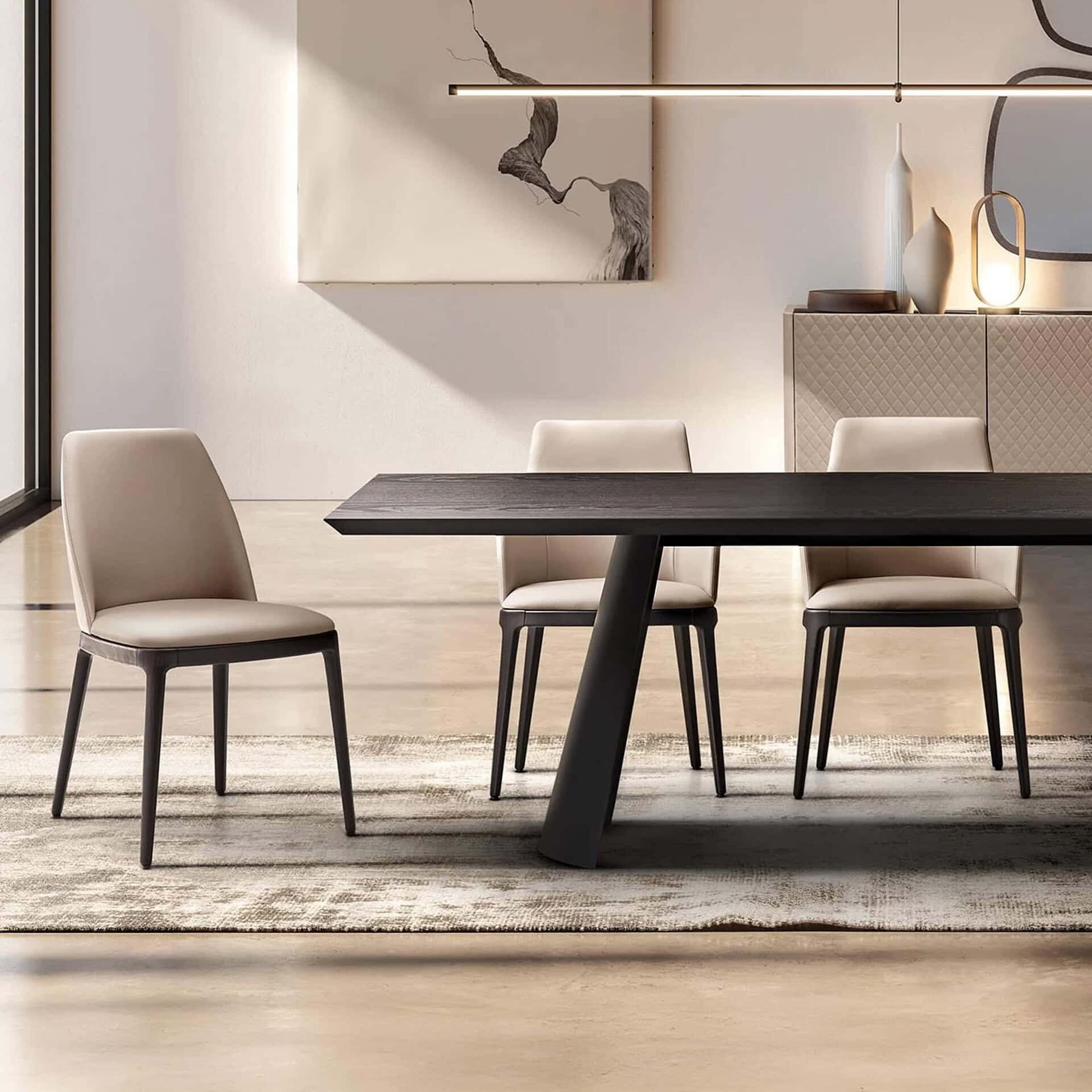 Contemporary dining room with modern table and elegant chairs, showcasing Sklar Furnishings' sophisticated furniture collection.