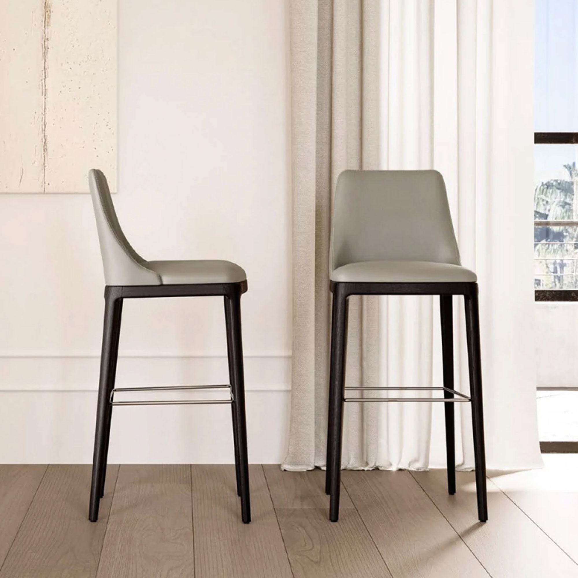 Max Stool with wooden legs in a bright dining setting