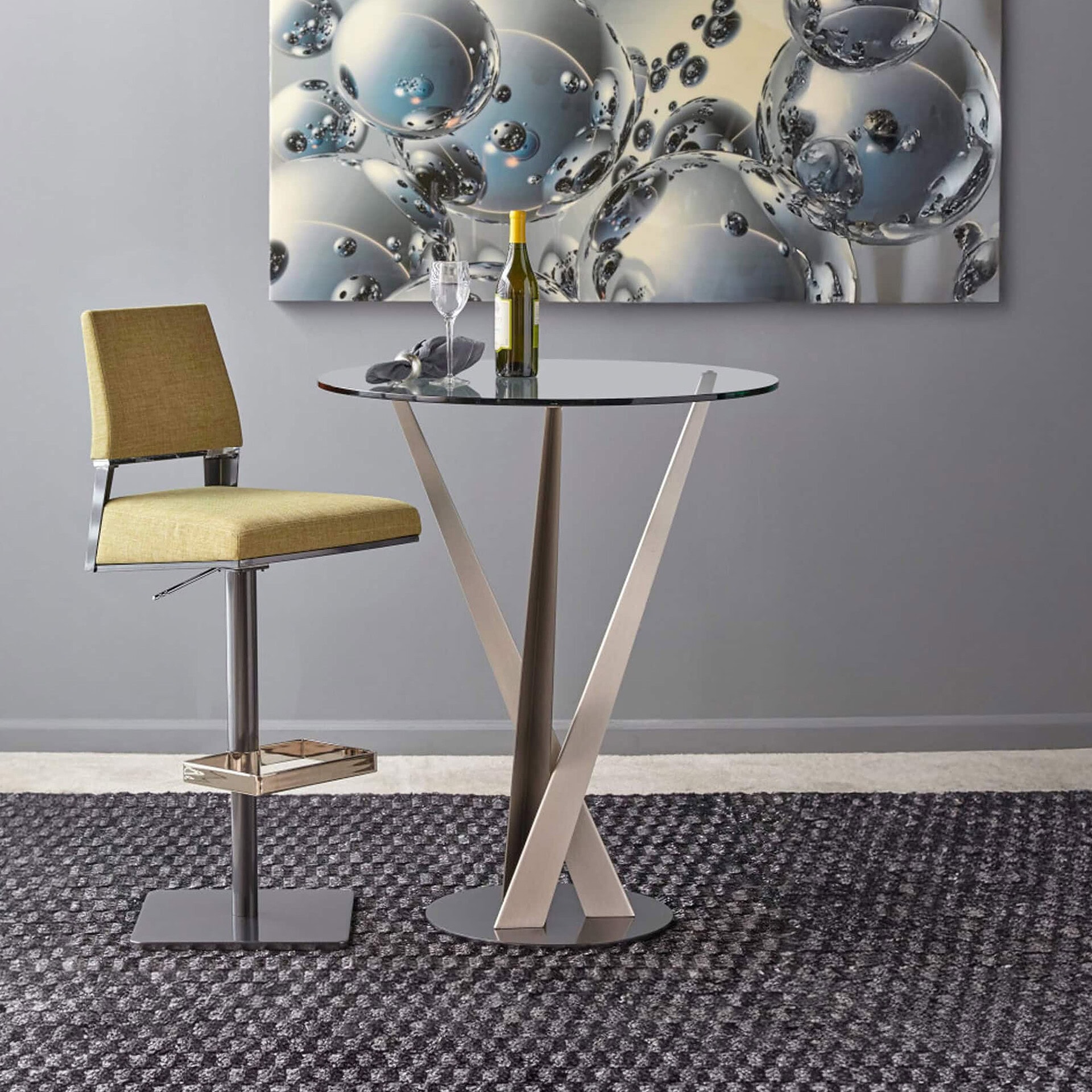 Elegant glass top pub table with unique sculptural base for modern interiors.