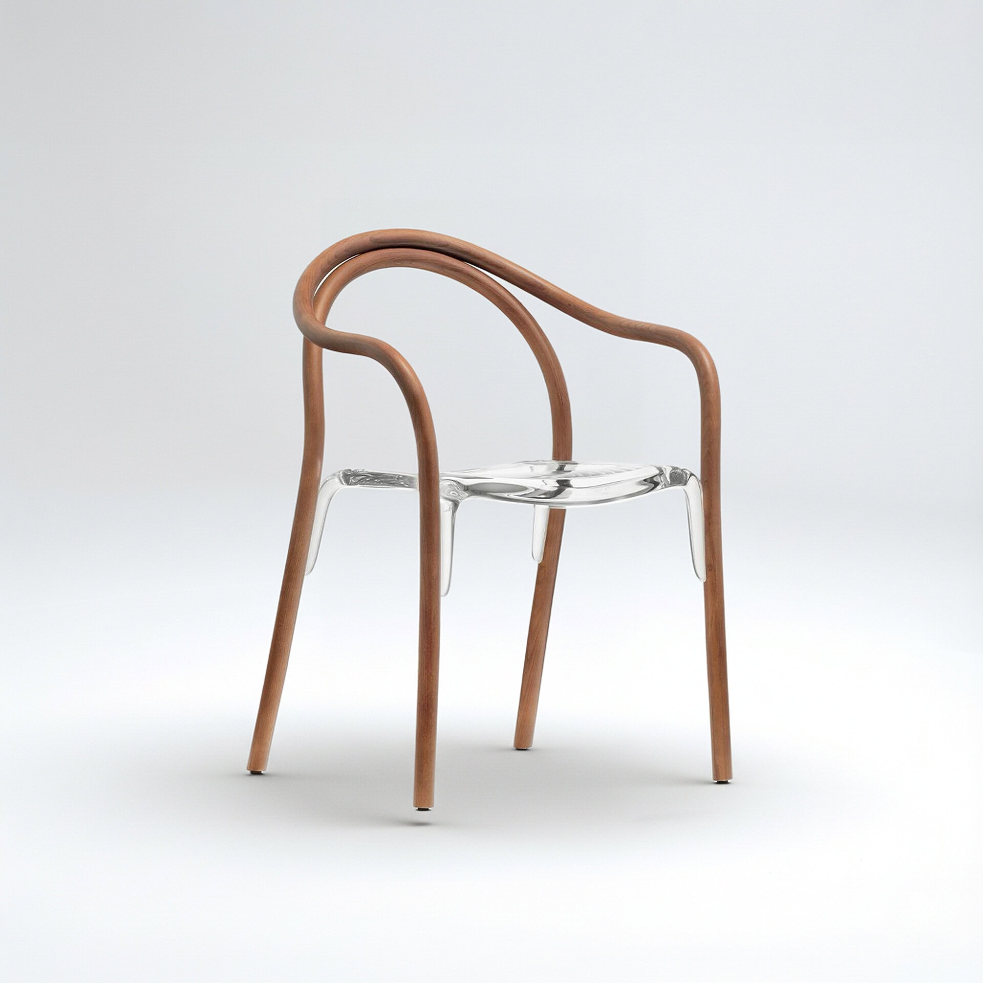 Contemporary acrylic and wood chair with curved armrests and minimalist design.