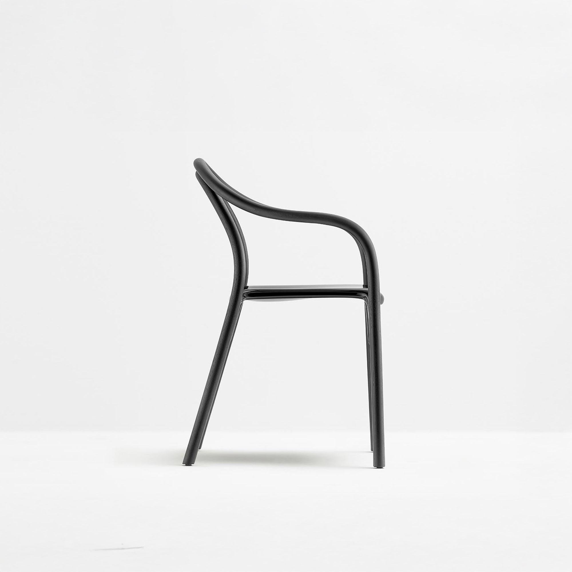 Pedrali Soul 3745 Armchair in black, side profile view highlighting curved wooden frame