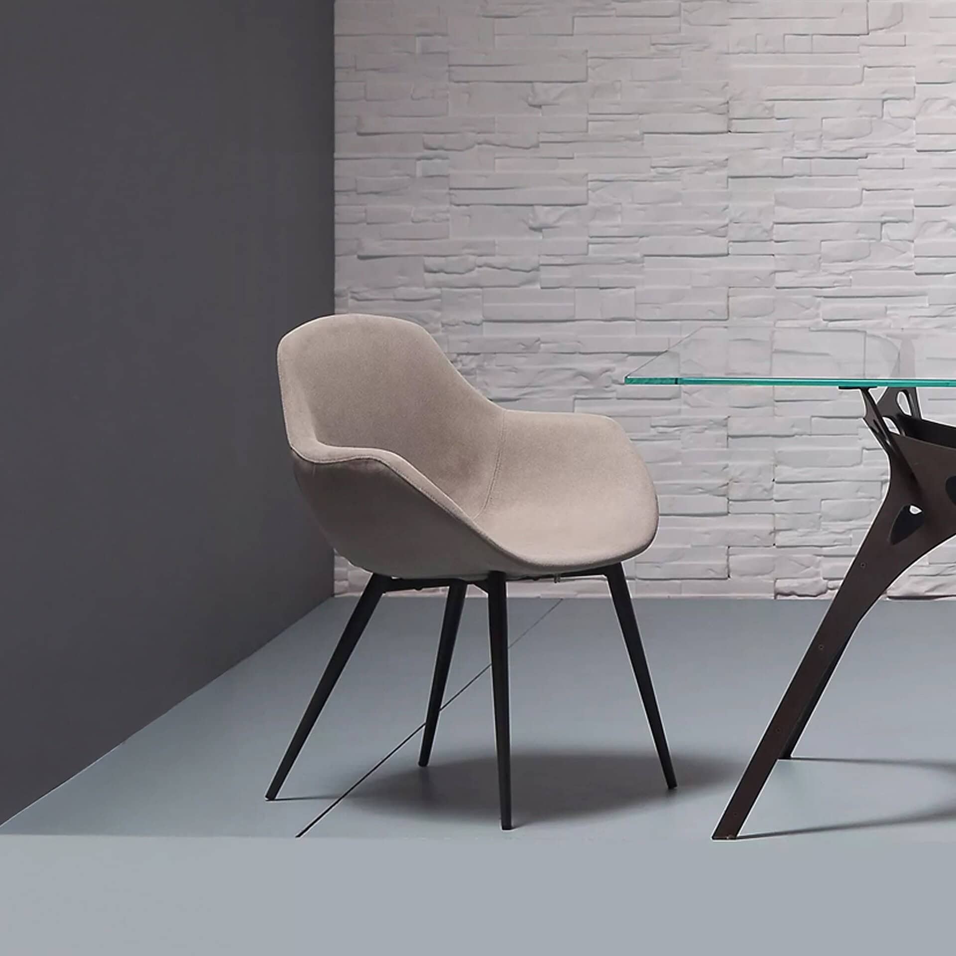 Maya Dining Chairs in beige fabric around a modern dining table in a styled interior